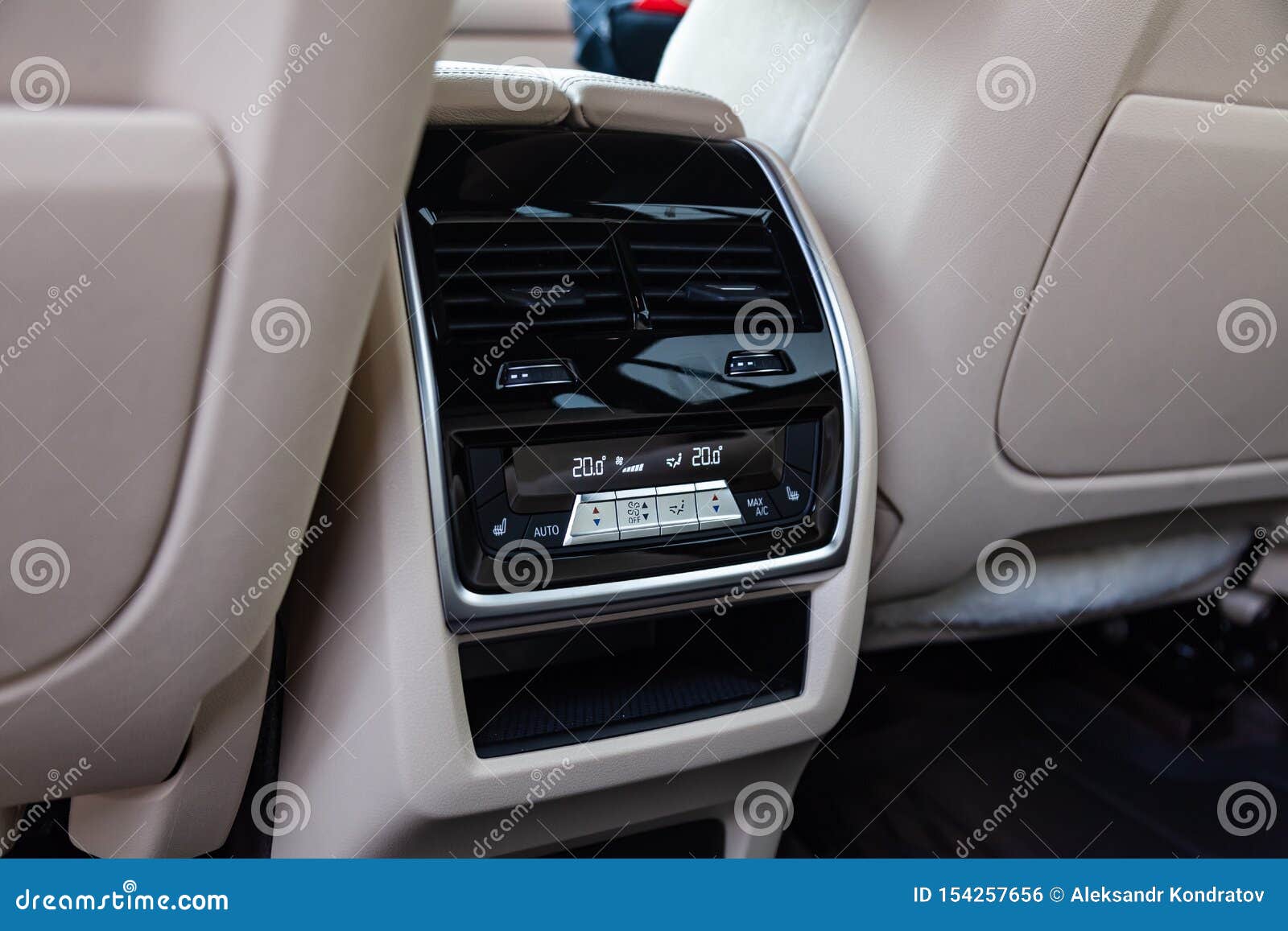 View To The White And Brown Interior Of Car With Dashboard