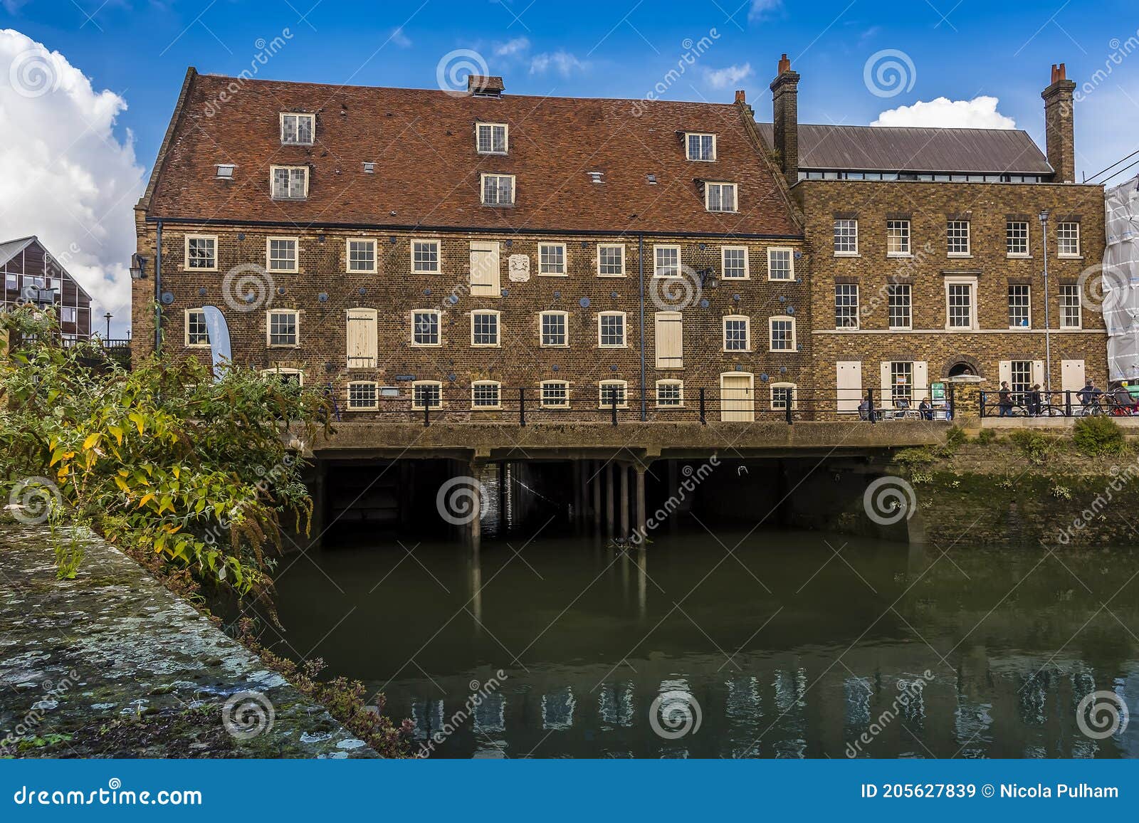 a view towards the eighteen century, three mills complex showing the waterway under the mills in lee valley, london