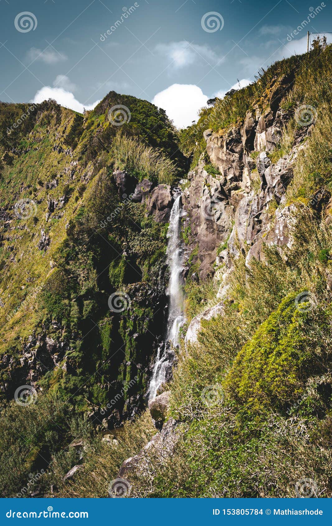 view towards waterfall in nordeste near lighthouse ponta do arnel in sao miguel island, azores