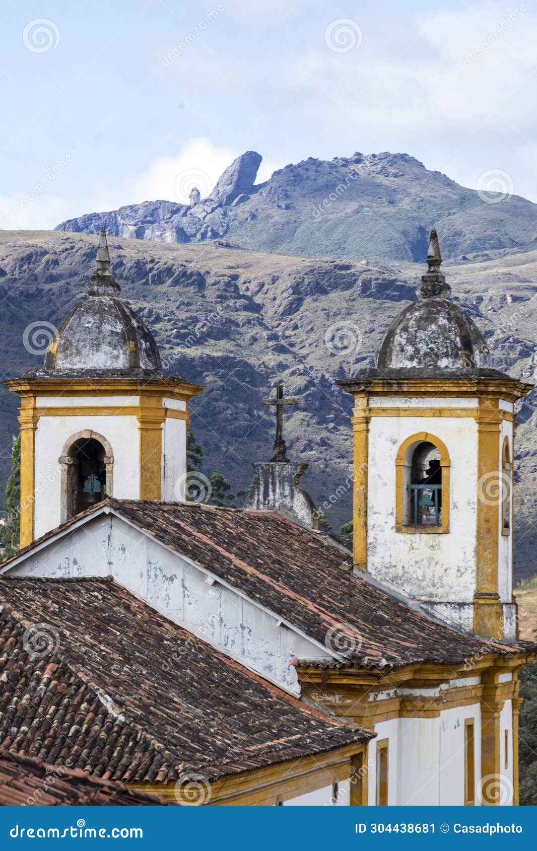 view of towers of historic baroque church igreja nossa senhora das merces e perdoes, and mountains, ouro preto, minas gerais,