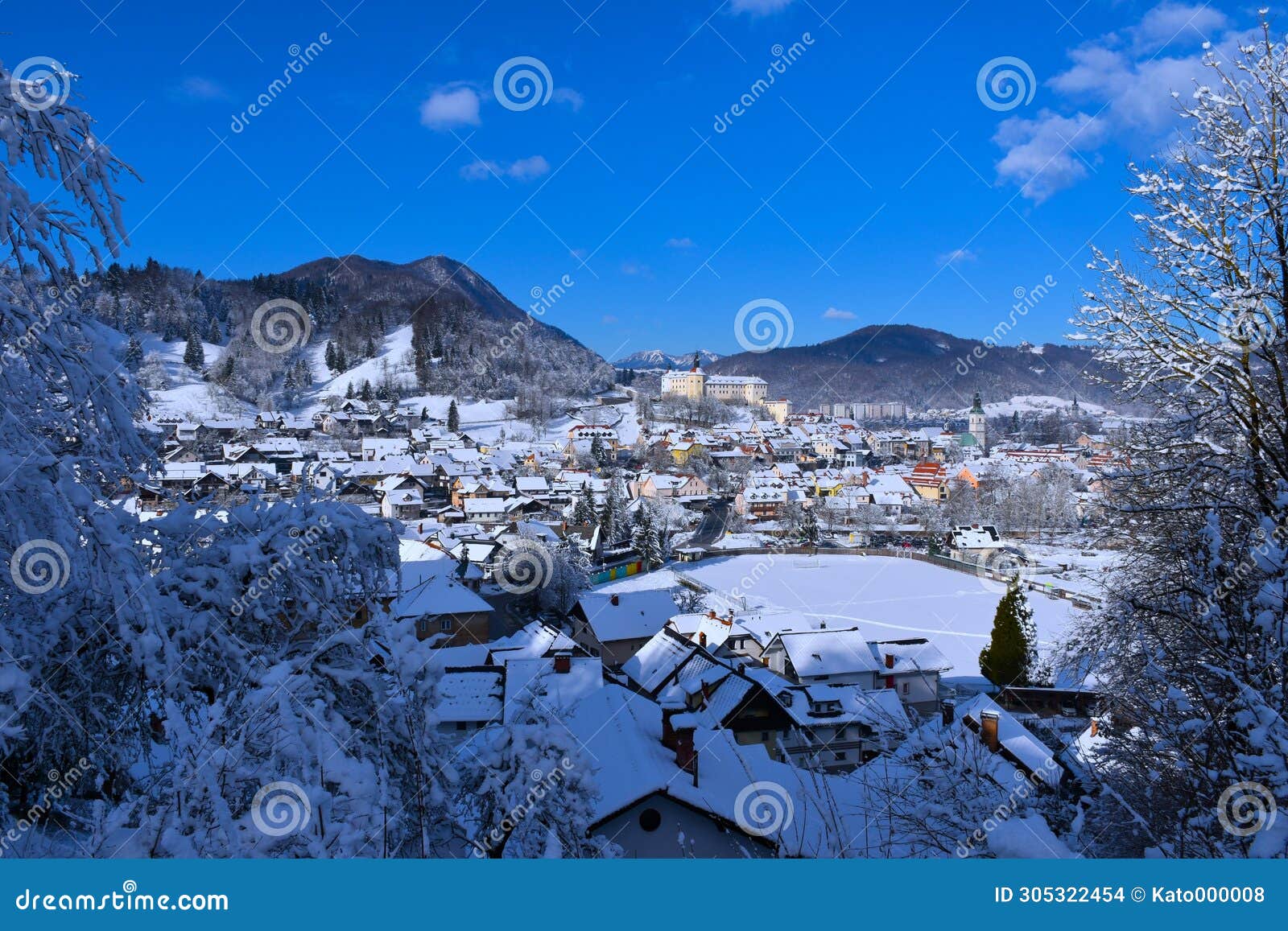view of the town of skofja loka and the castle above in gorenjska, slovenia