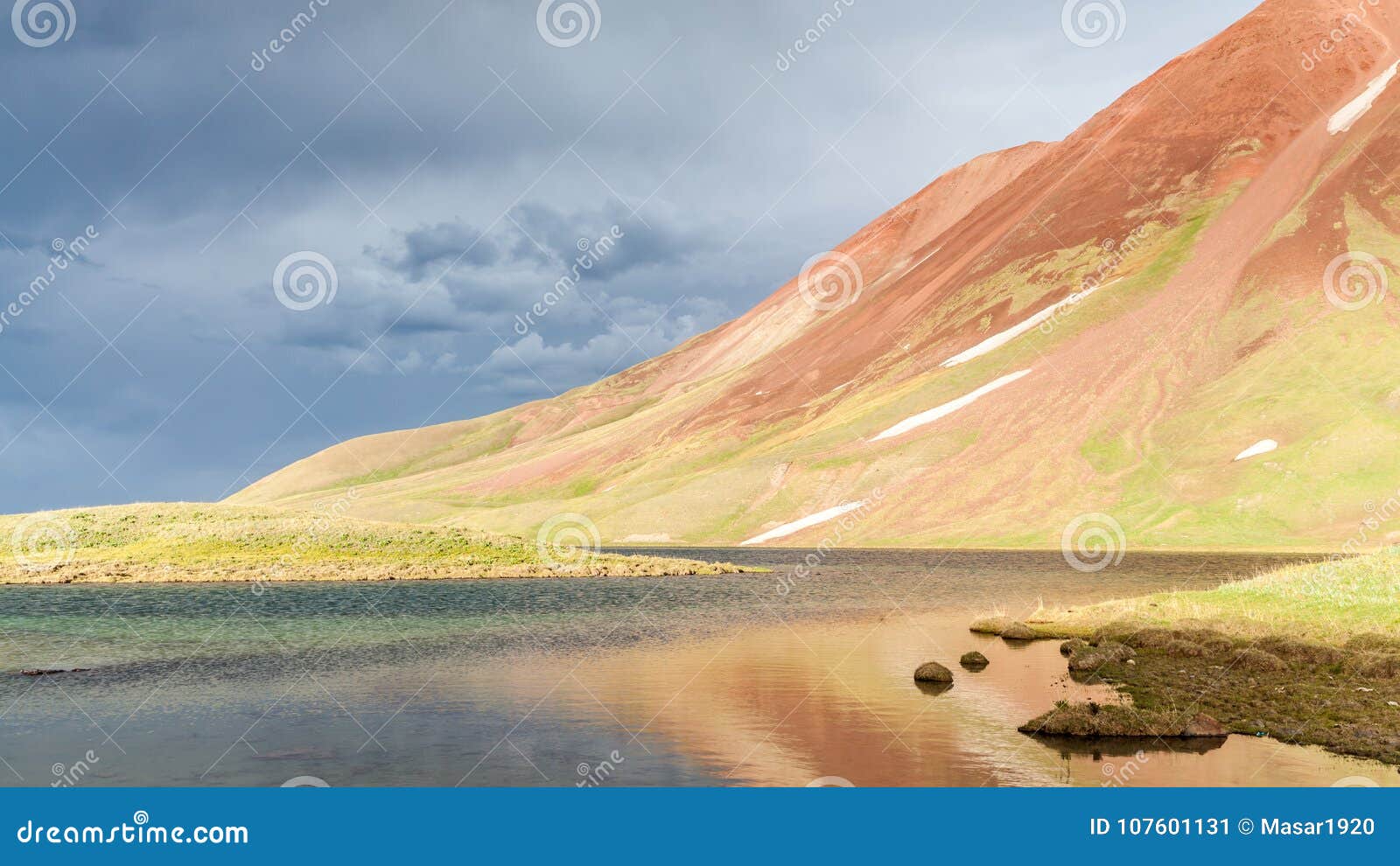 view of tulpar kul lake in kyrgyzstan during the storm