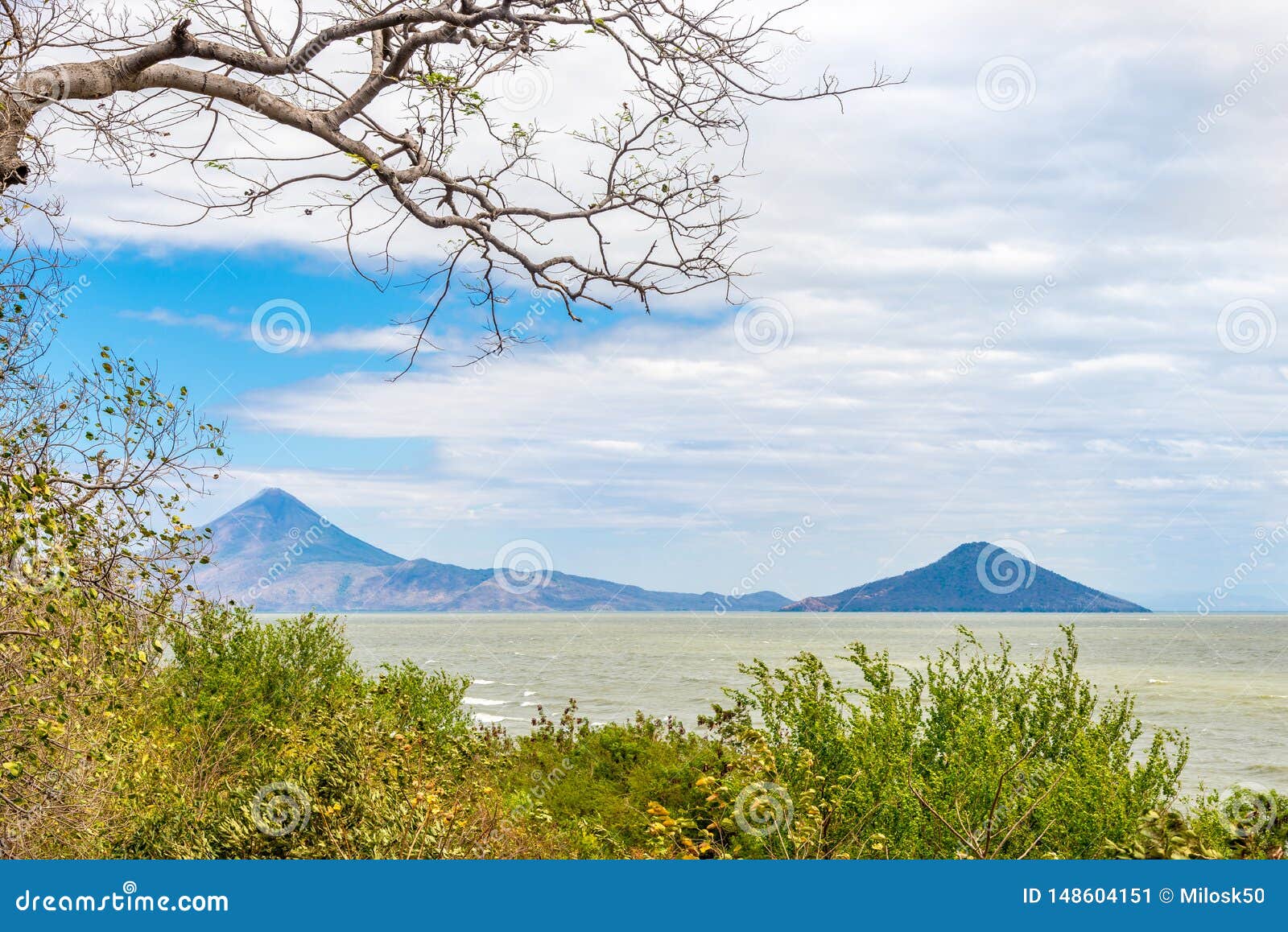 view at the volcanos momotombo and momotombito with xolotlan lake in nicaragua