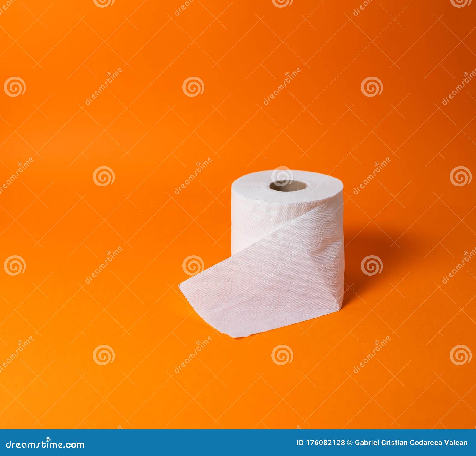 view of a white toilet paper roll over an orange background