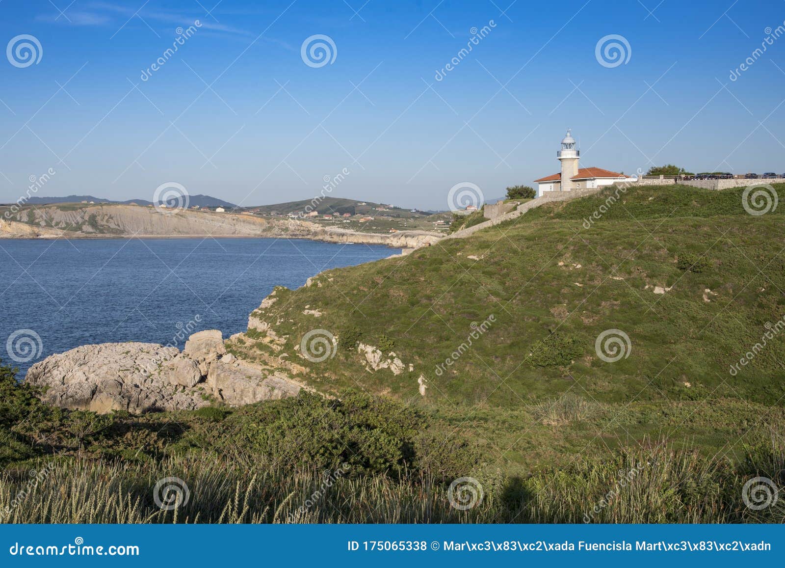 views of the lighthouse of punta del torco de afuera in suances, cantabria, spain.