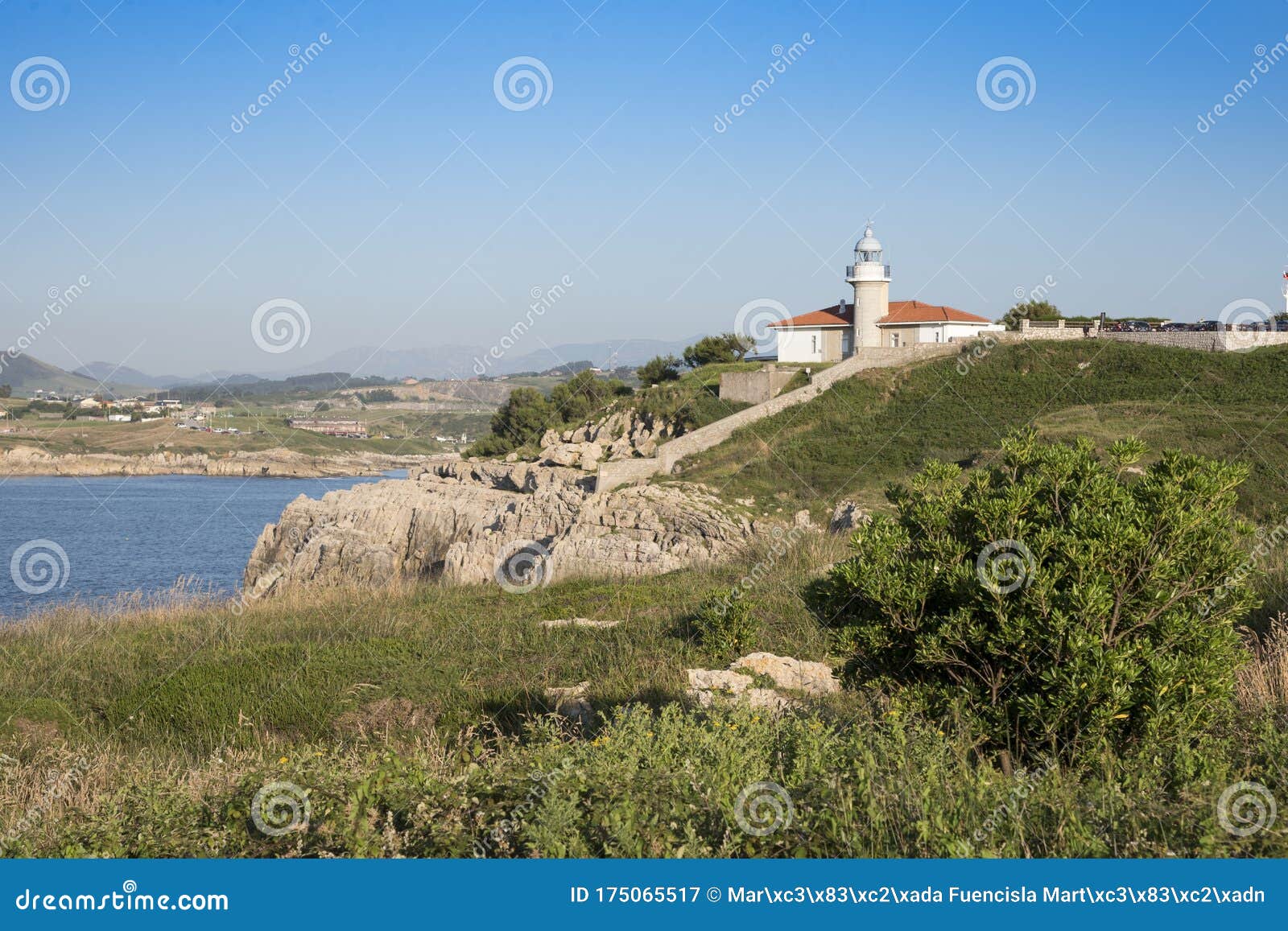 views of the lighthouse of punta del torco de afuera in suances, cantabria, spain.