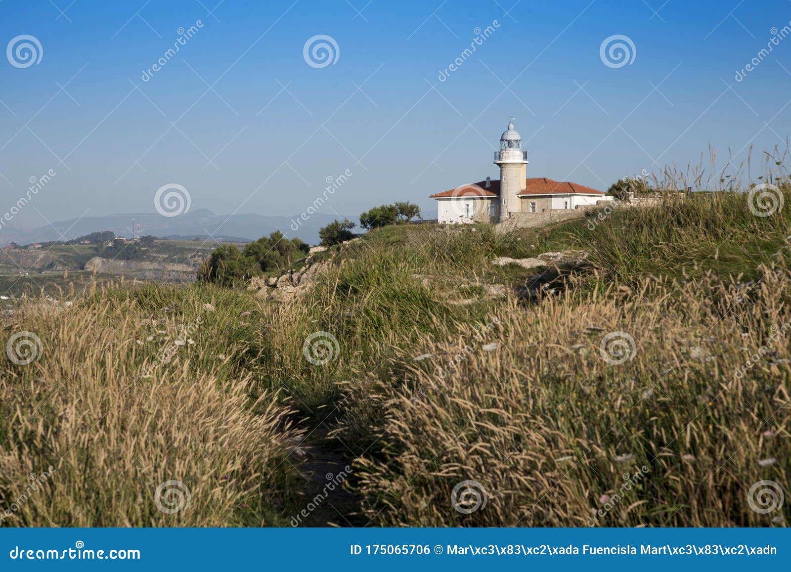 views of the lighthouse of punta del torco de afuera in suances, cantabria, spain.