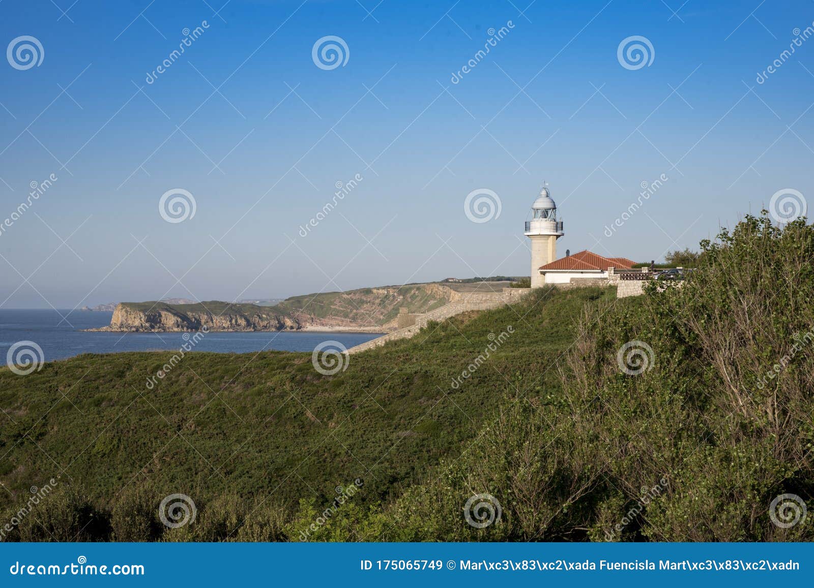 views of the lighthouse of punta del torco de afuera in suances, cantabria, spain.