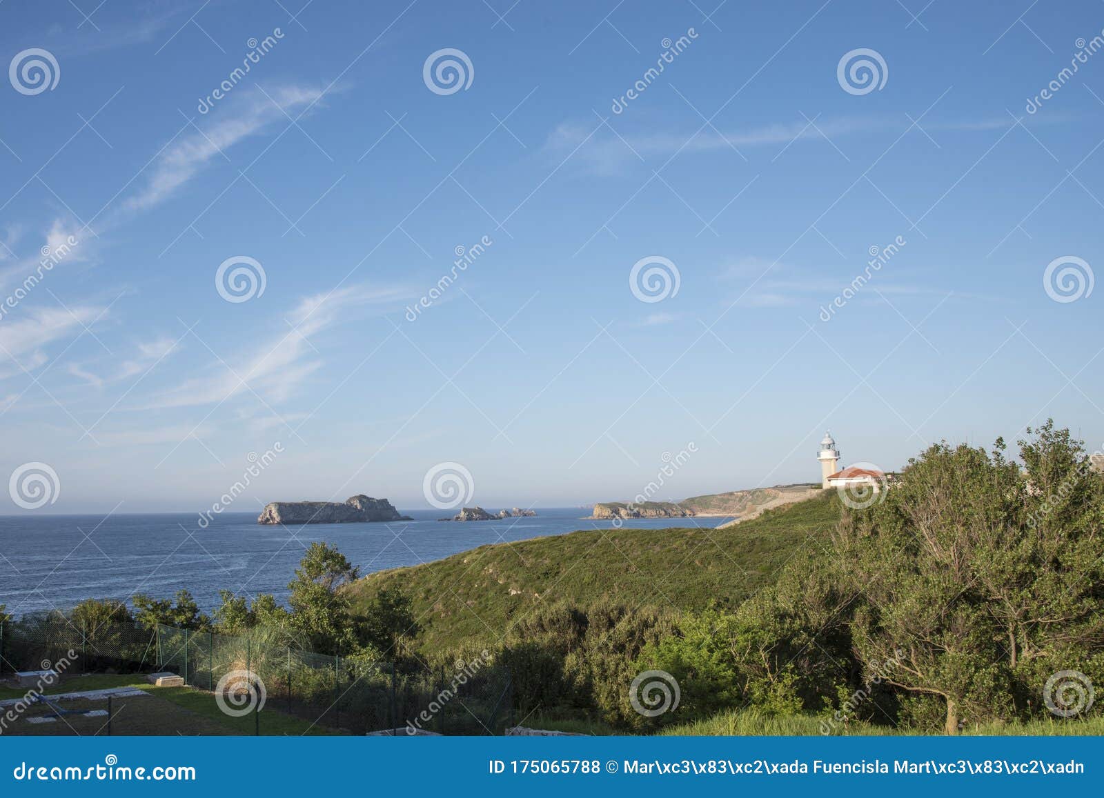 views of the lighthouse of punta del torco de afuera in suances, cantabria, spain.