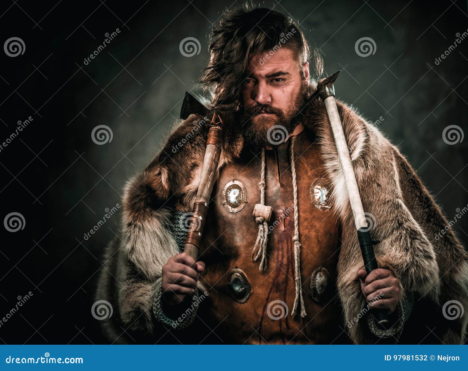 Viking with Cold Weapon in a Traditional Warrior Clothes Stock Photo