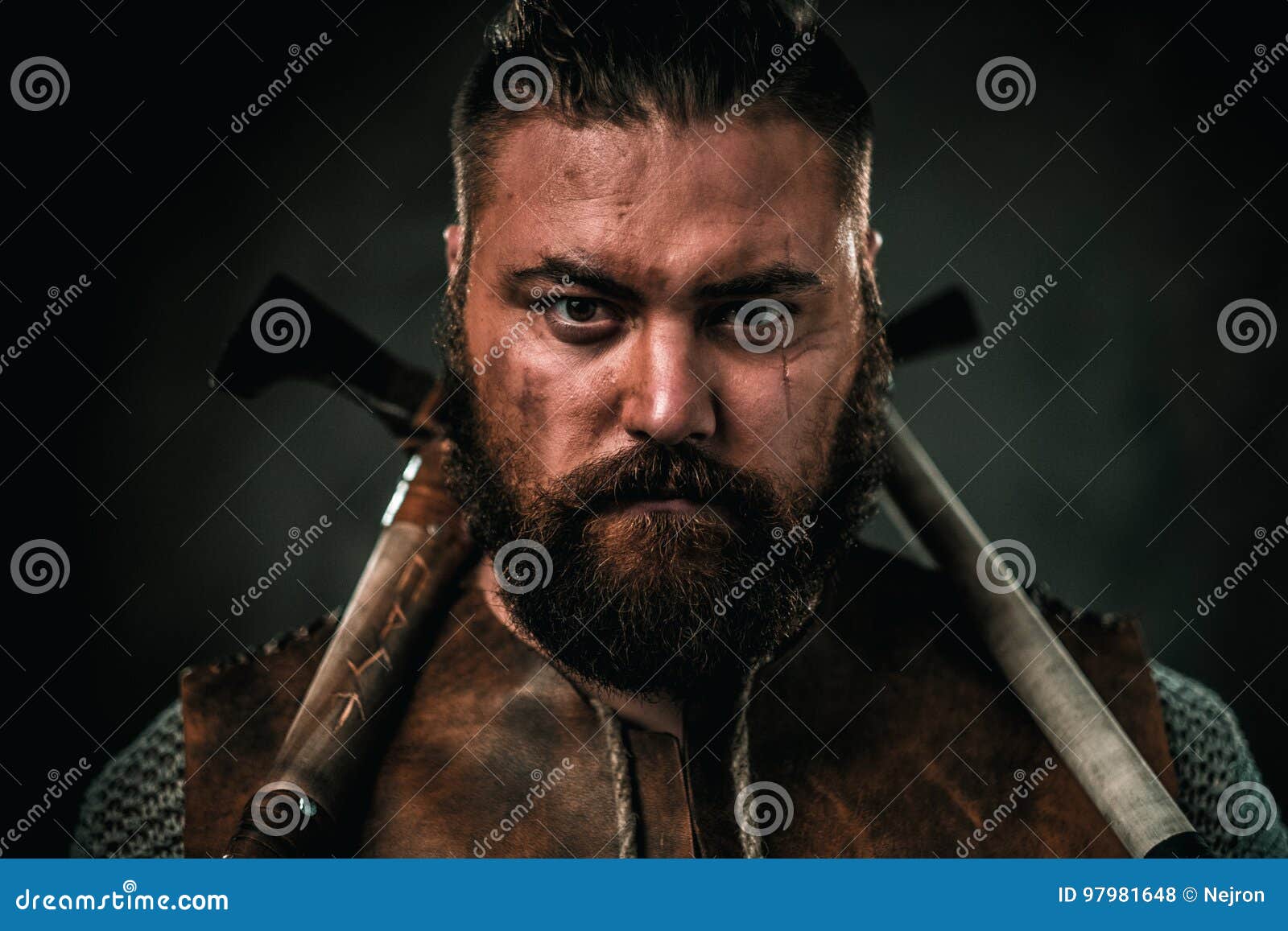 Viking with Cold Weapon in a Traditional Warrior Clothes Stock Photo