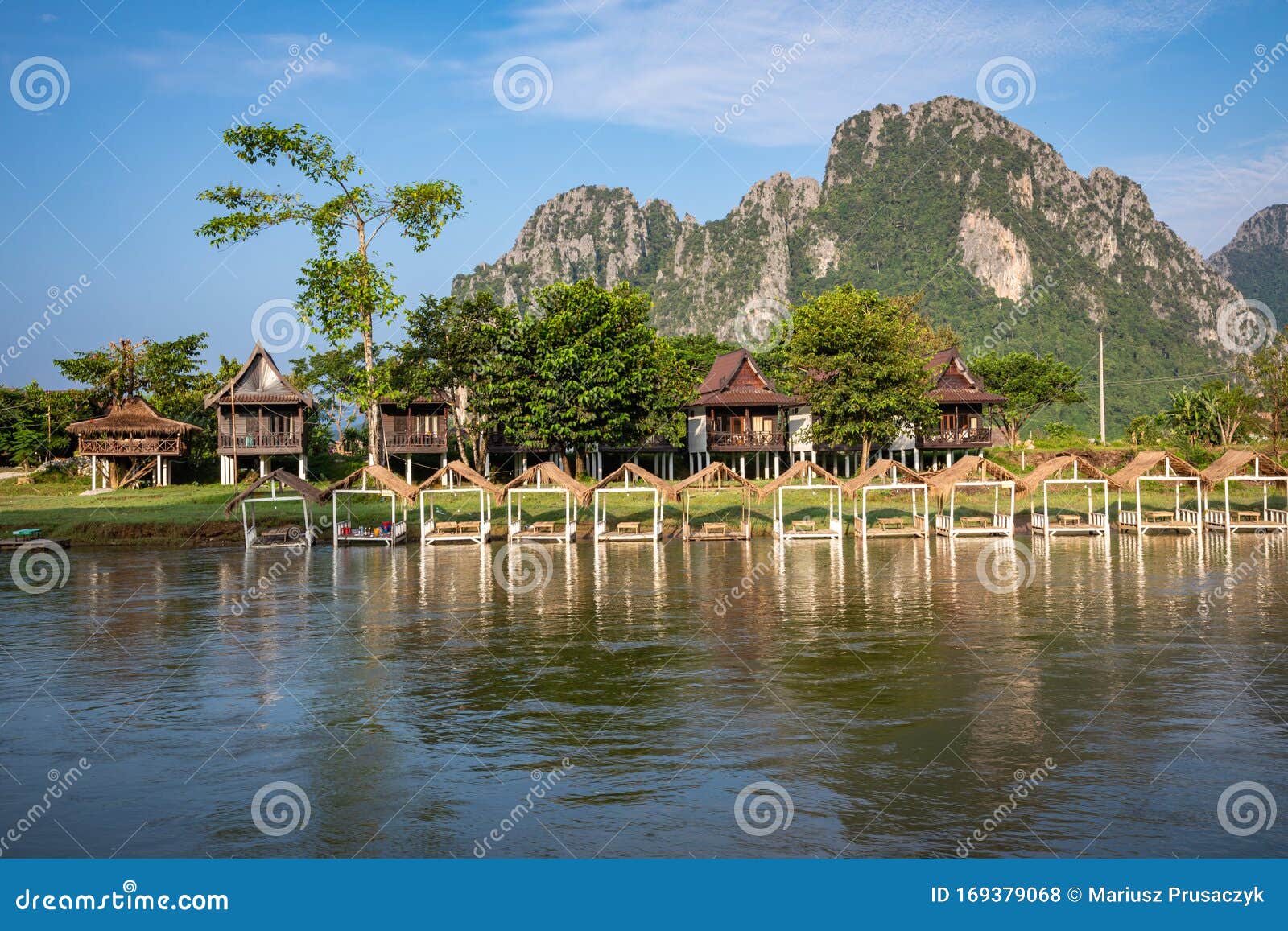 village and mountain in vang vieng, laos and nam song rive , laos. southeast asia