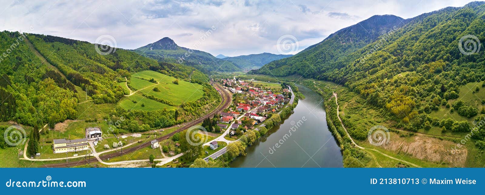 village, river and road in mountain valley. green mountain meadows and hills. kraÃÂ¾oviansky meander on river bar. spring panorama