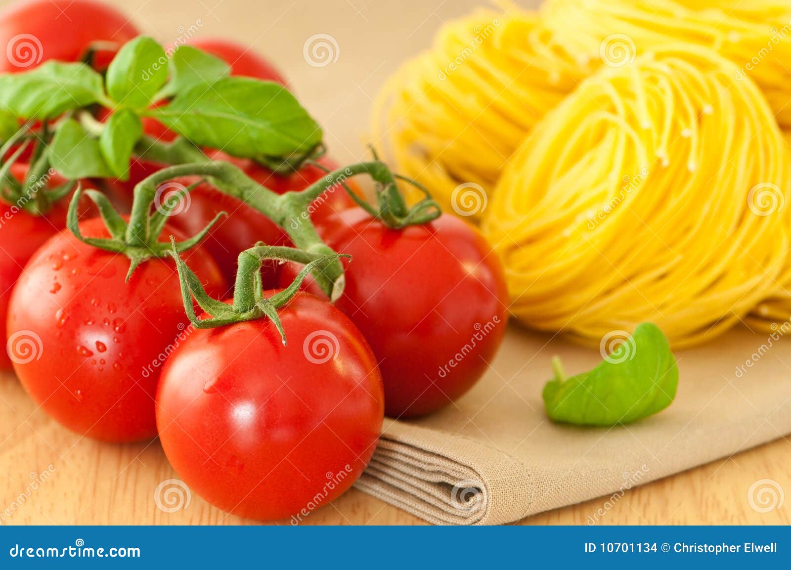 Vine Tomatoes with Pasta stock photo. Image of basil 10701134