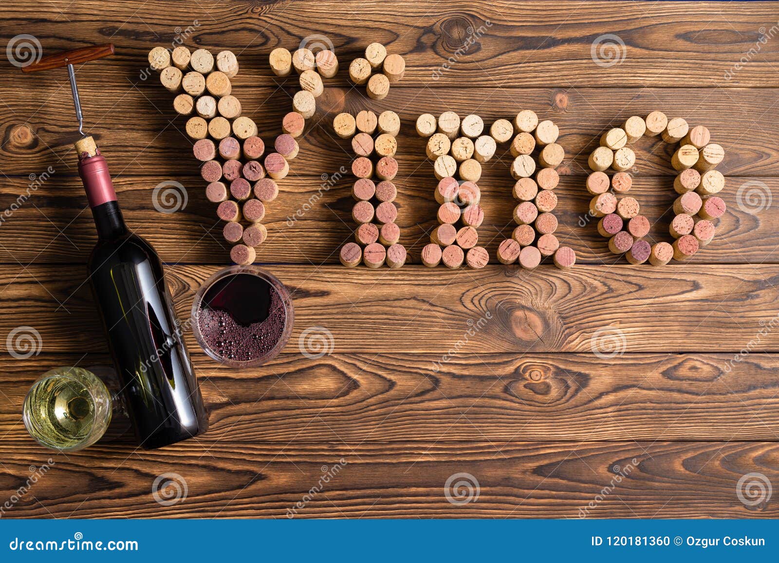 vino lettering made of corks on wooden background