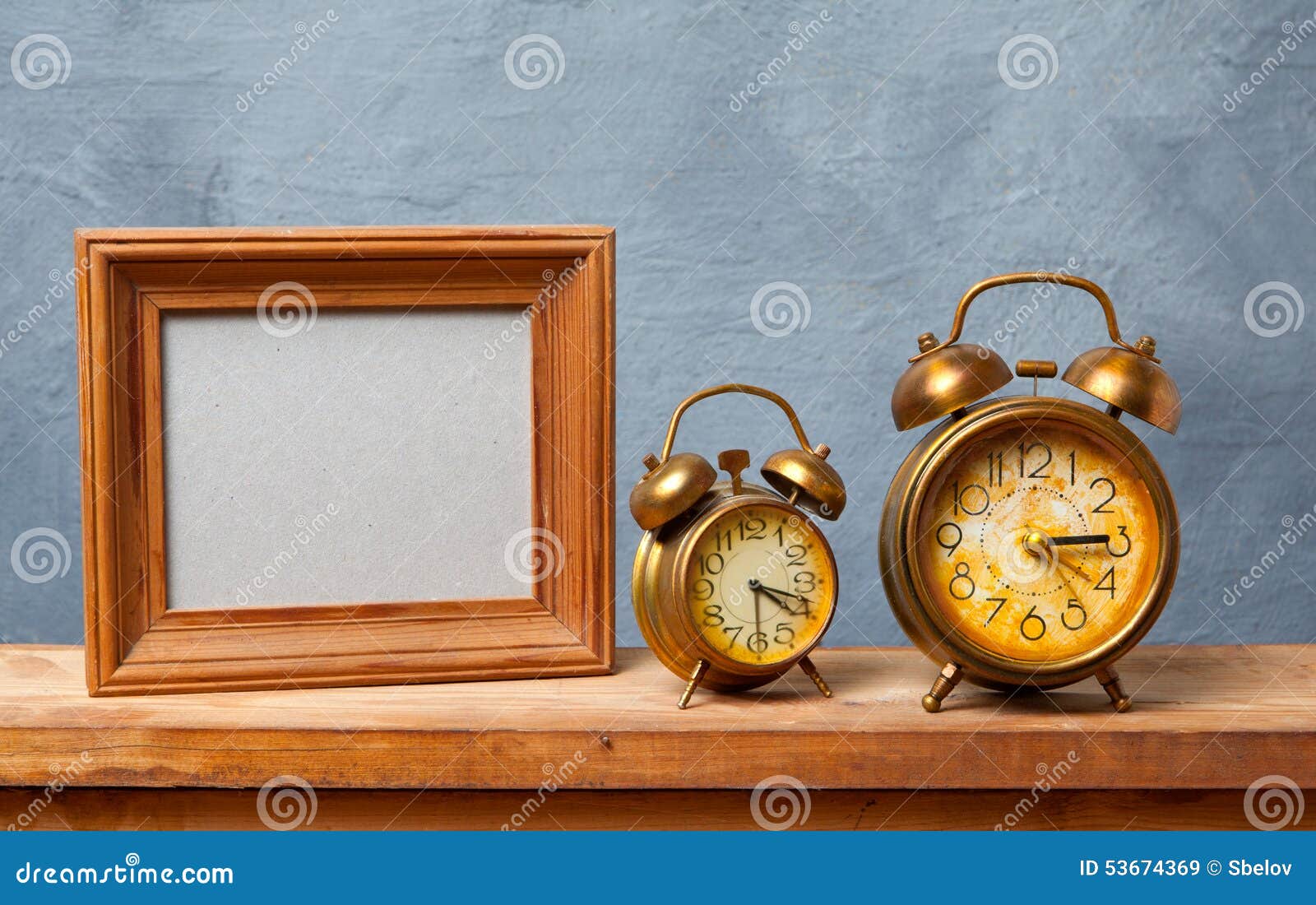 Vintage Alarm Clock On Rustic Wood Table. Shows 7 O'clock. Pile Royalty
