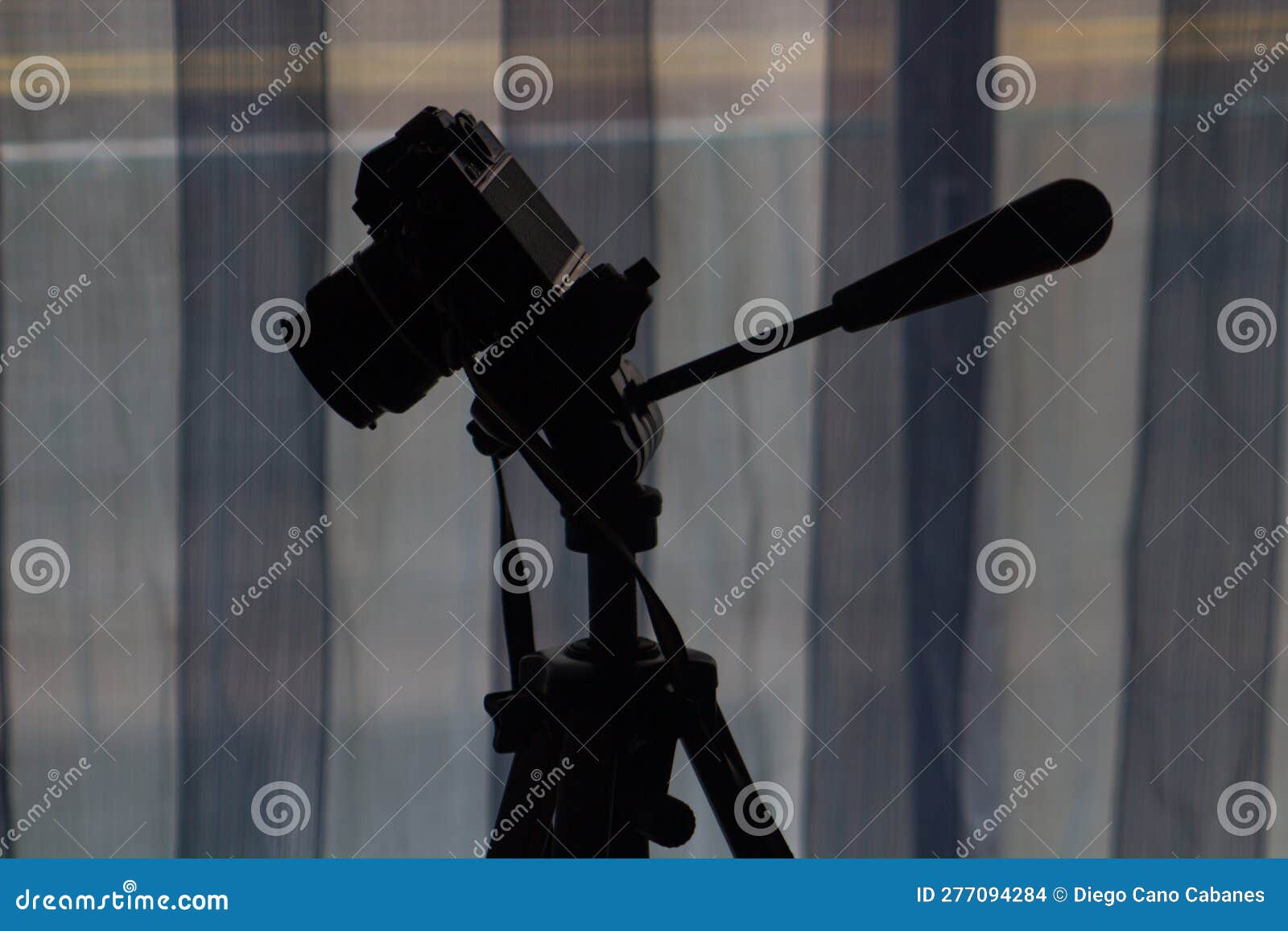 vintage analog photo camera silhouette on tripod