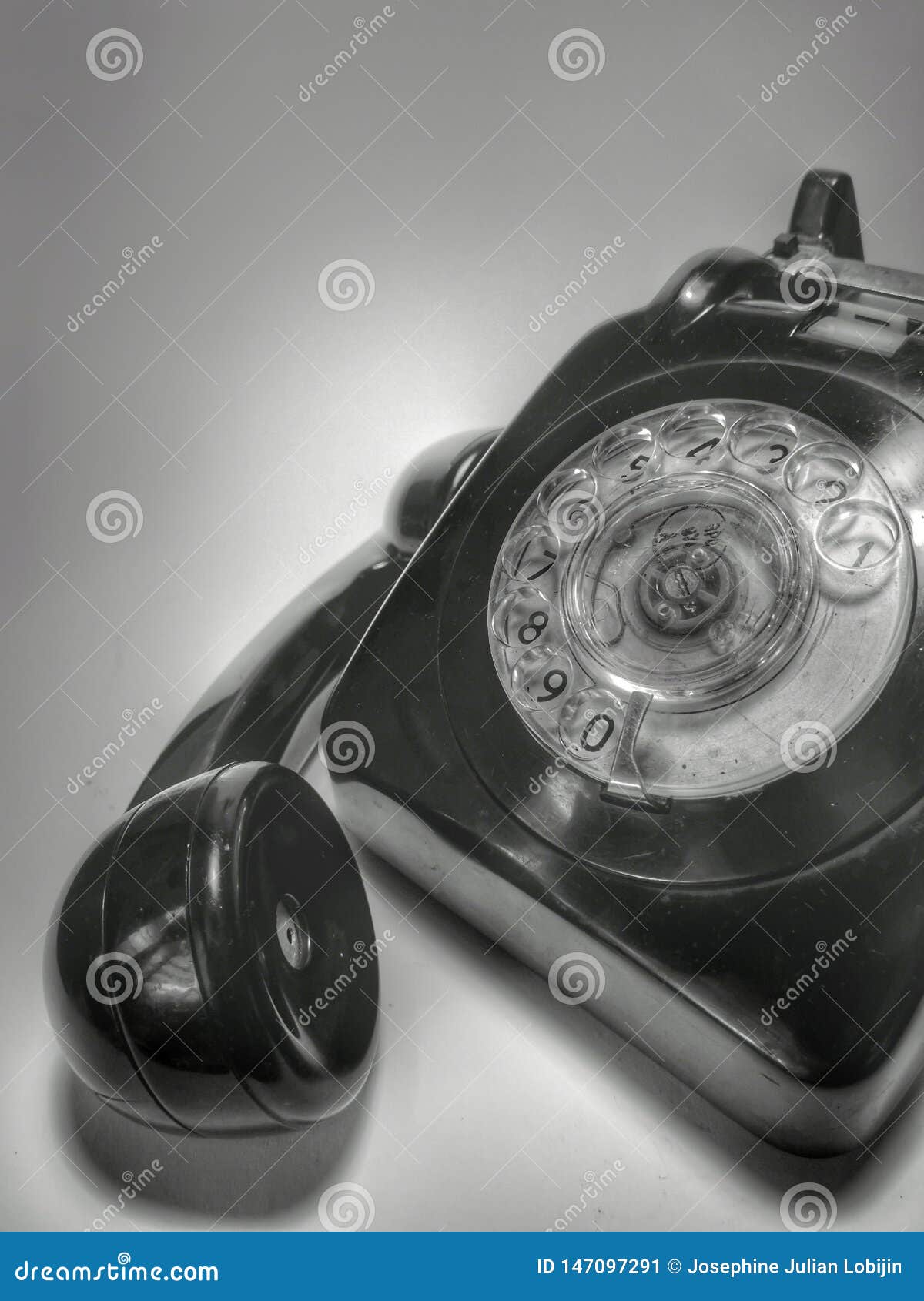 a vintage and antique telephone with white background.