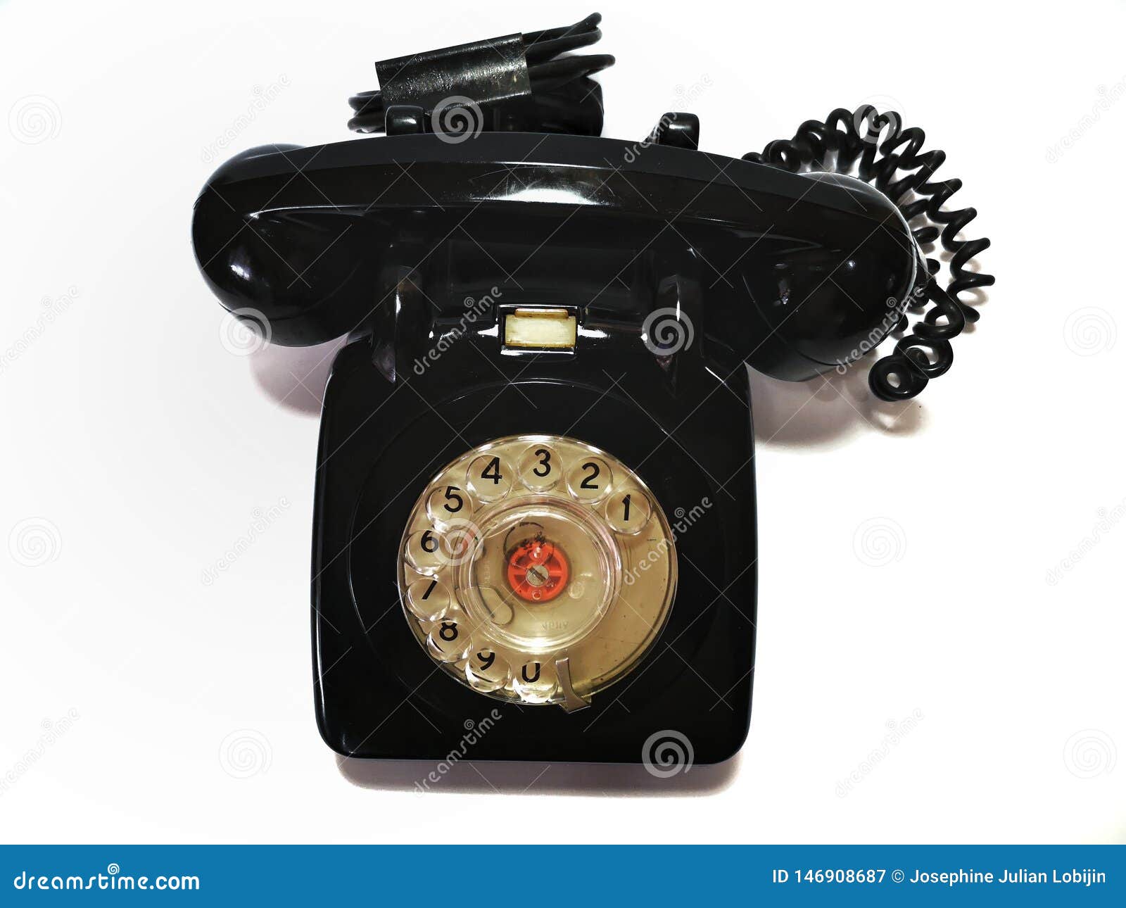 a vintage and antique telephone with white background.