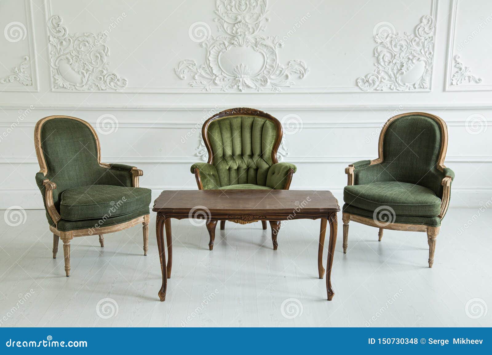 Career Frenzy lineup Vintage Armchairs and Coffee Table Against the Wall with Plaster Stucco  Patterns. Selective Focus Stock Photo - Image of object, decor: 150730348