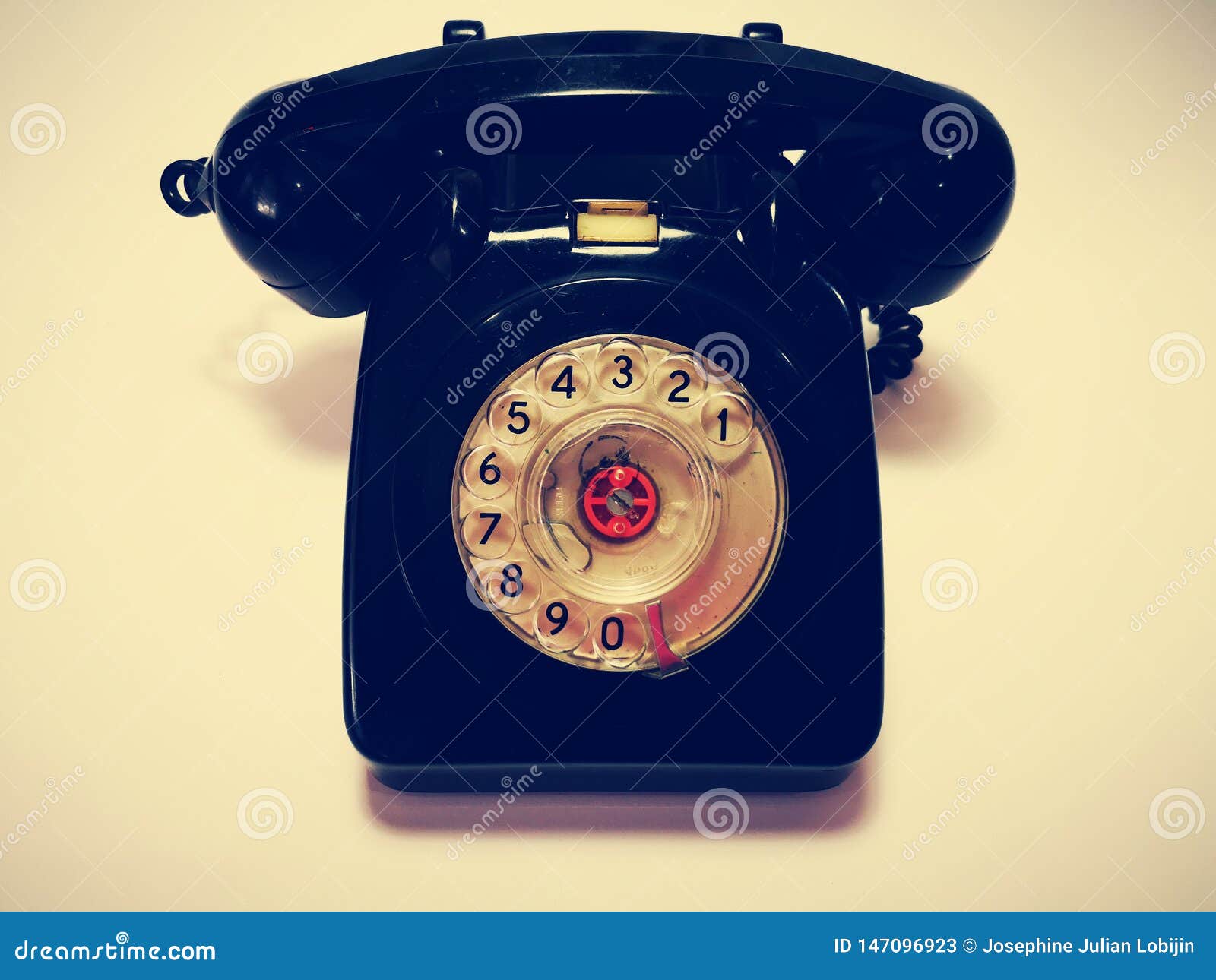 a vintage and antique telephone with white background.