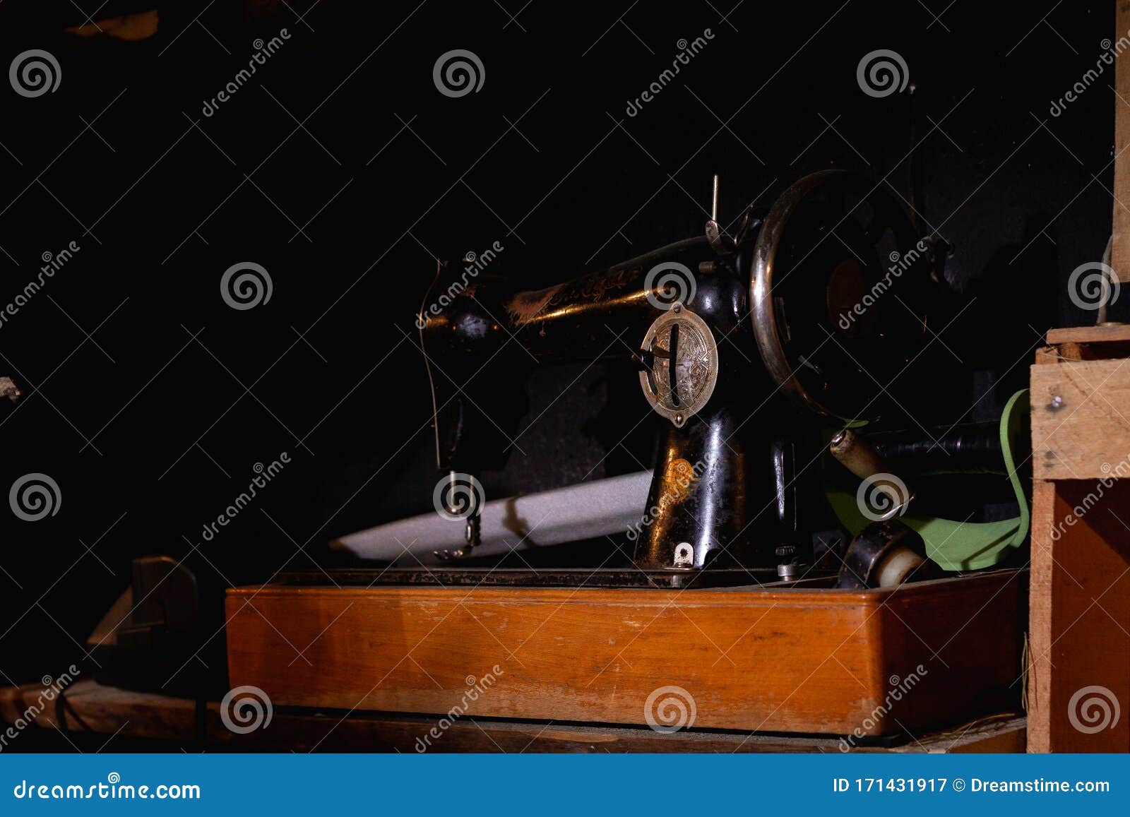 Vintage Black Sewing Machine on a Dark Background Stock Image - Image