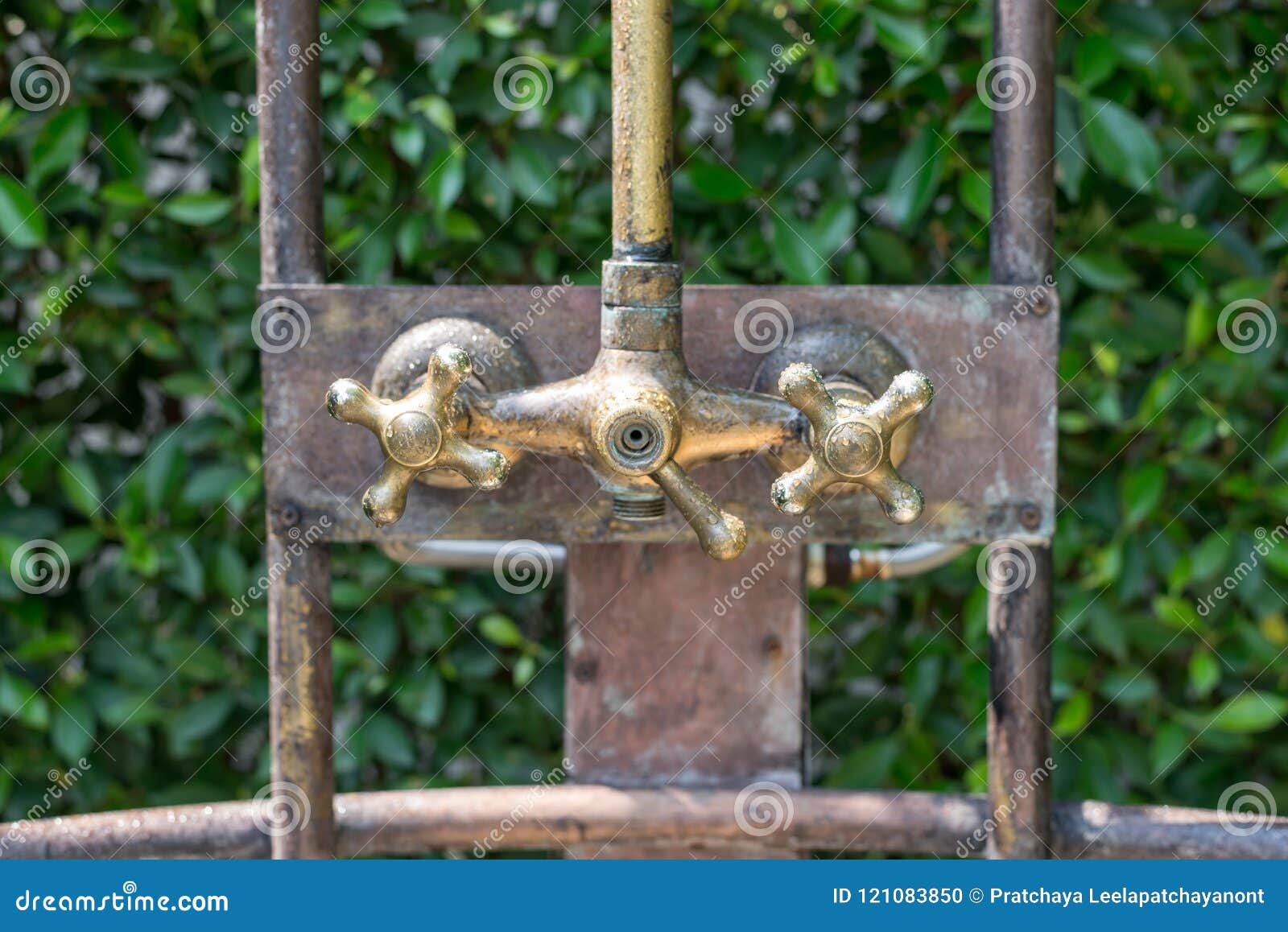 Vintage Bronze Shower Faucet Of Hot And Cold Water Stock Photo