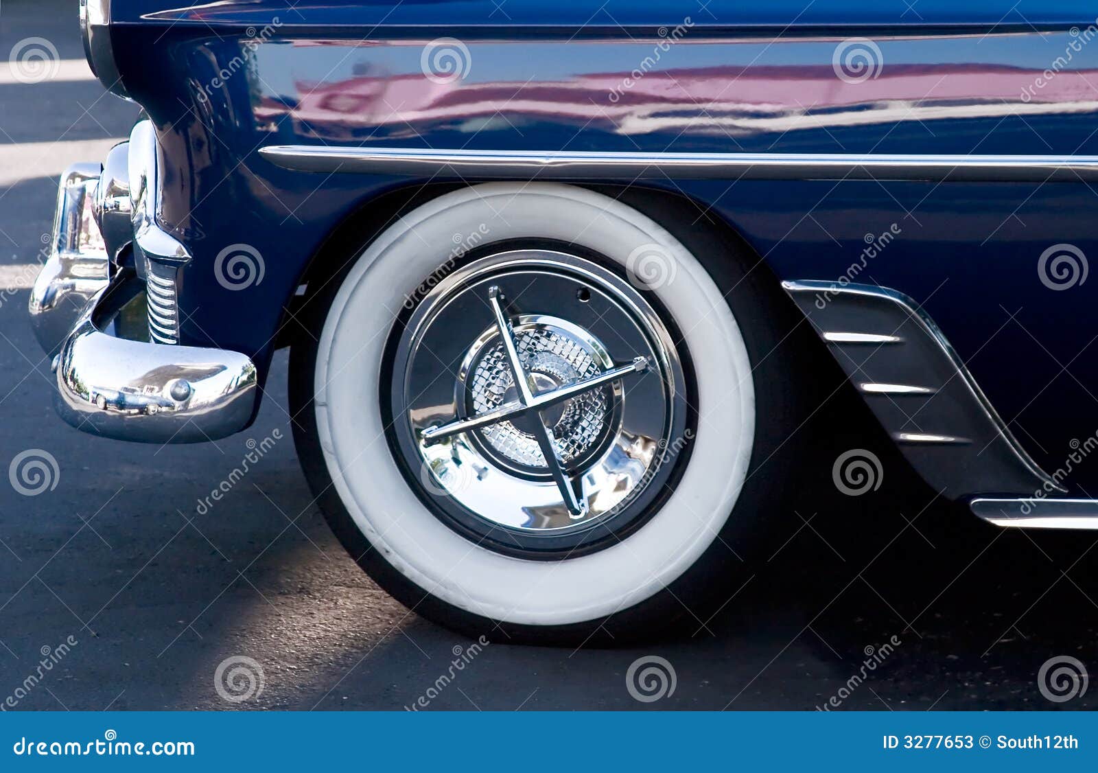 Closeup Of Whitewall Tires, Fender And Hubcap On Old Vintage Car With