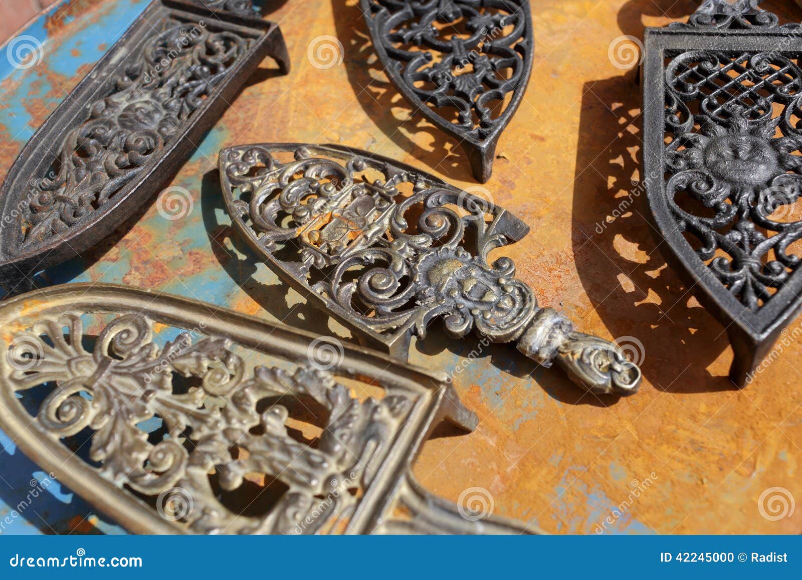 Vintage cast iron trivets stock photo. Image of store 42245000