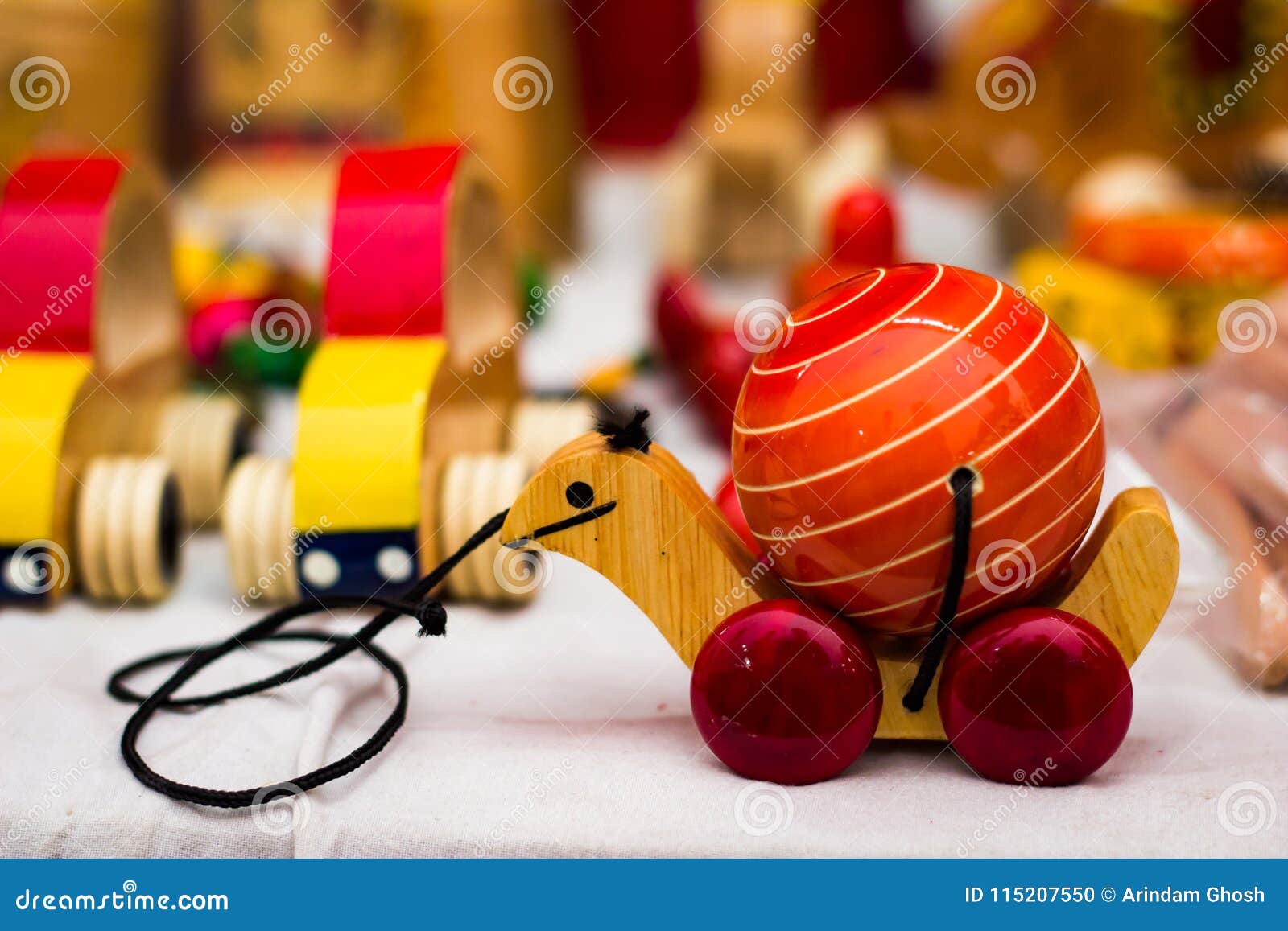 Royalty Free Stock Vintage colourful old wooden turtle tortoise toy on wheels to be dragged by thread