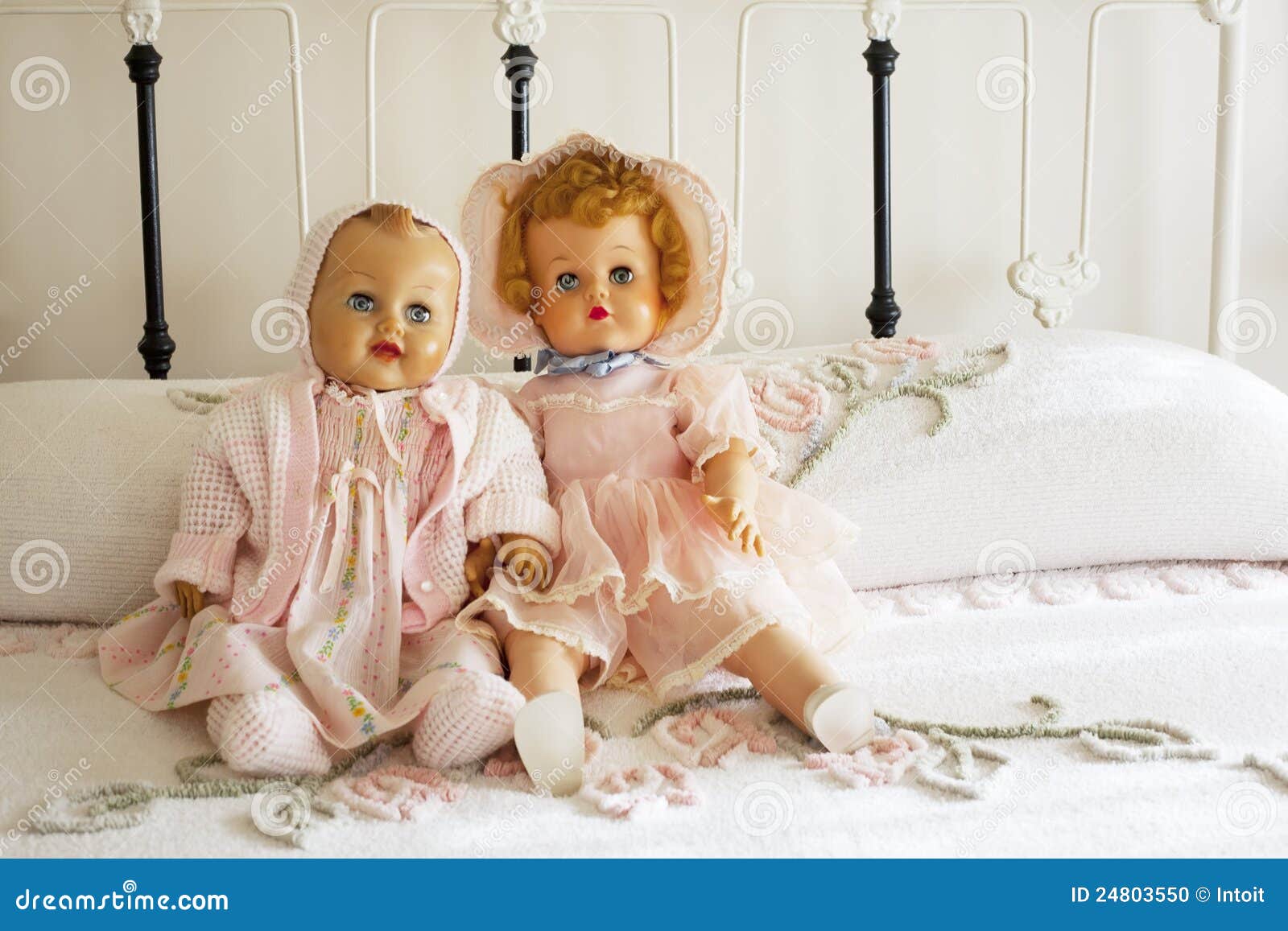 Vintage Dolls on Chanille Bedspread on Iron Bed Stock Photo Image of