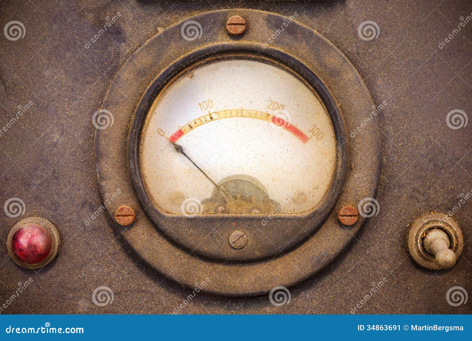 vintage dusty volt meter in a metal casing