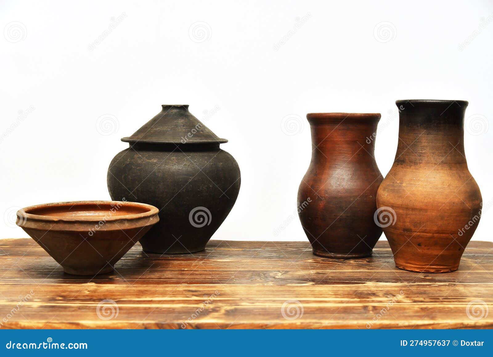 Vintage Earthenware Clay Pots, Bowls and Jugs on a Wooden Table on a White  Background Stock Image - Image of utensils, museum: 274957637