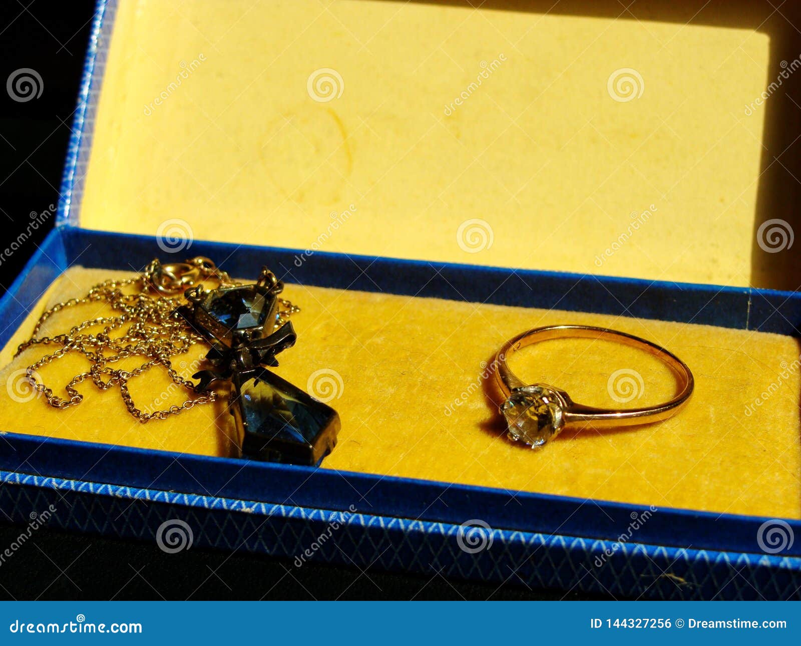 Vintage Neckless And Ring In Jewelry Box. Shadow Over Neckless ...