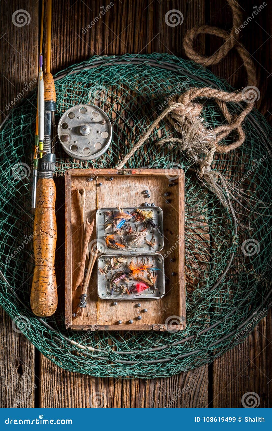 Vintage Fishing Tackle with Fishing Flies and Rods Stock Image