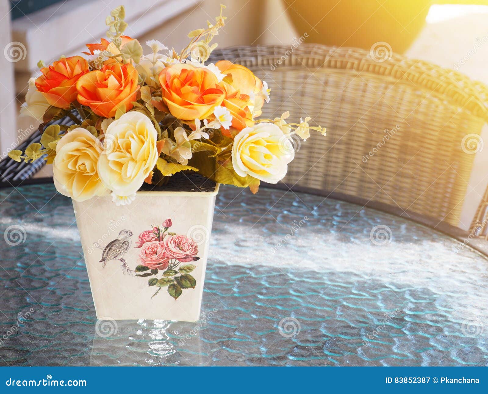 Vintage Flower Vase on Glass Table in Restaurant with Sunlight. Stock