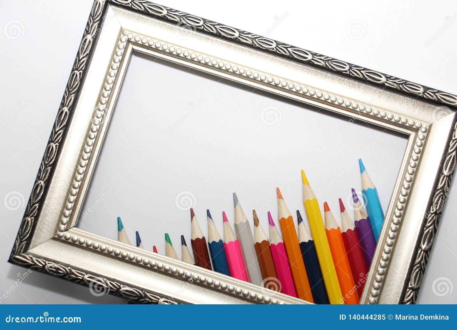 Vintage Frame for Paintings and Colored Pencils on a White Background