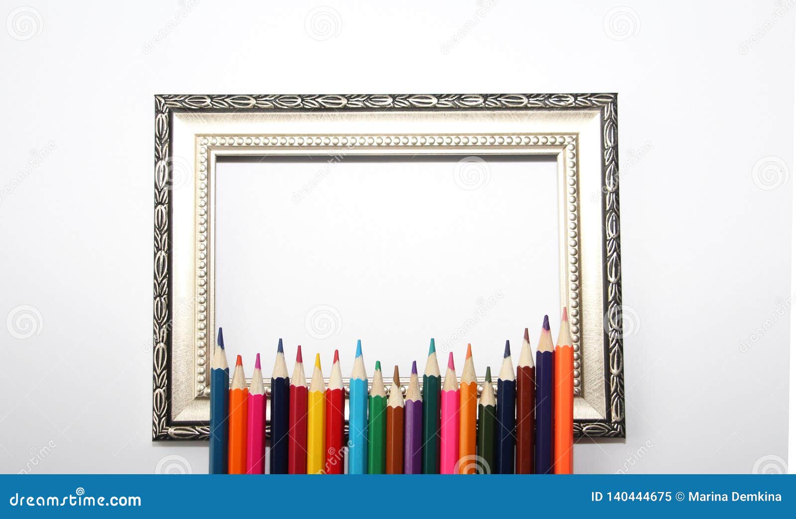 Vintage Frame for Paintings and Colored Pencils on a White Background