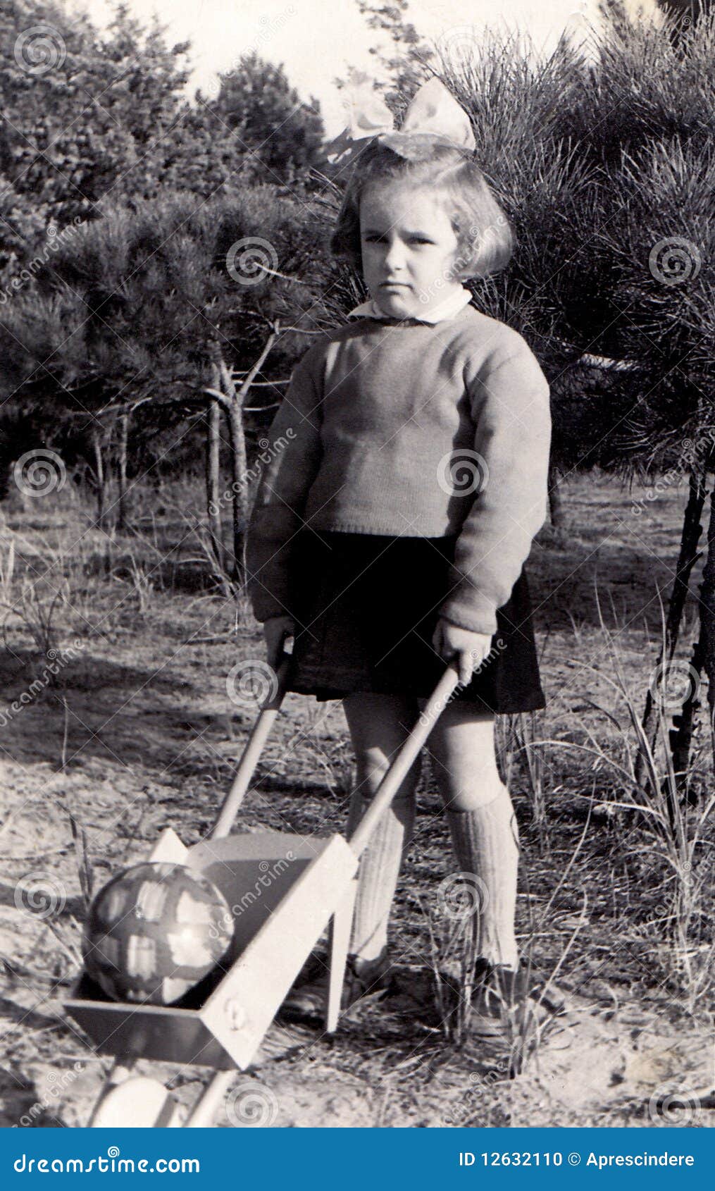 vintage girl with wheelbarrow