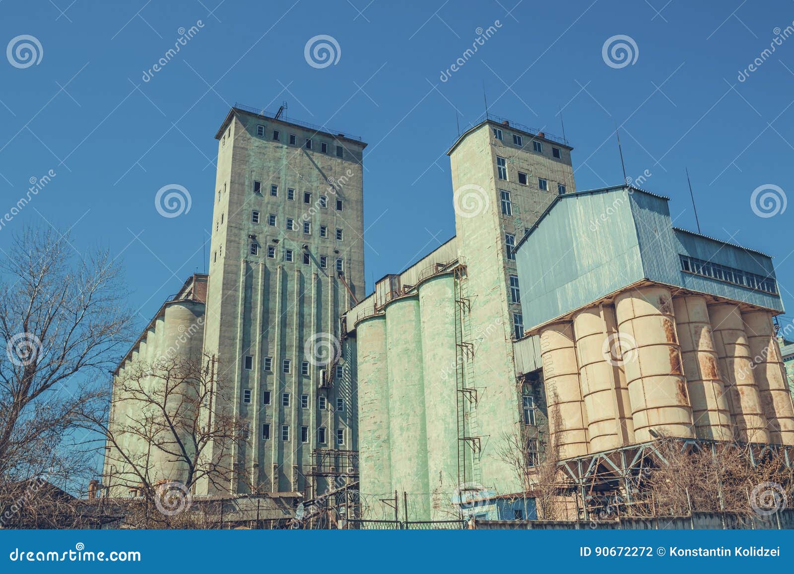Vintage Grain Elevator Against a Blue Sky. Stock Photo Image of