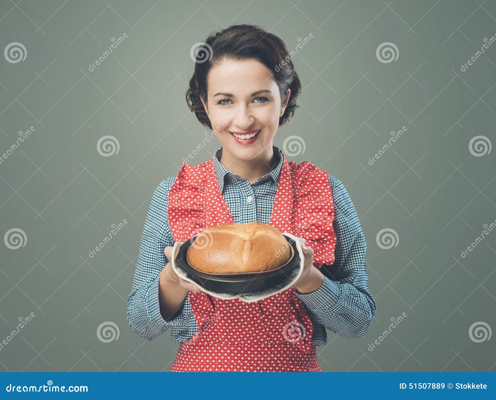 Vintage Housewife Holding an Homemade Cake Stock Image photo