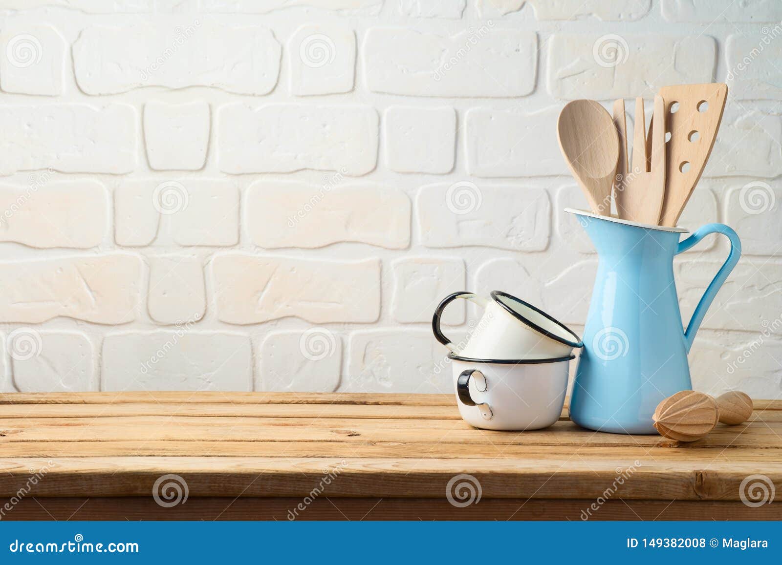 vintage kitchen utensils and tableware on wooden table