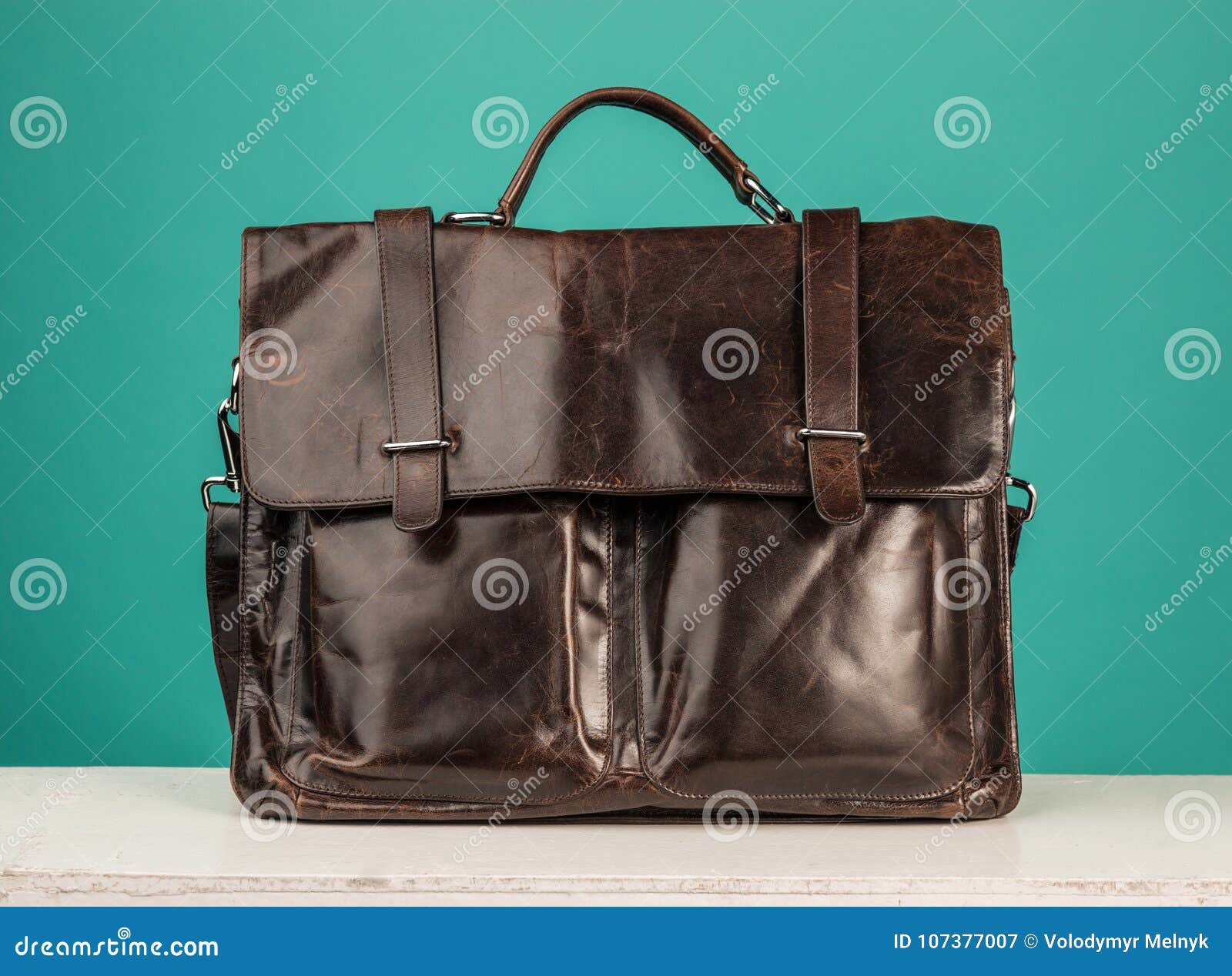 A Vintage Leather Briefcase on a Blue Background Stock Image Image of