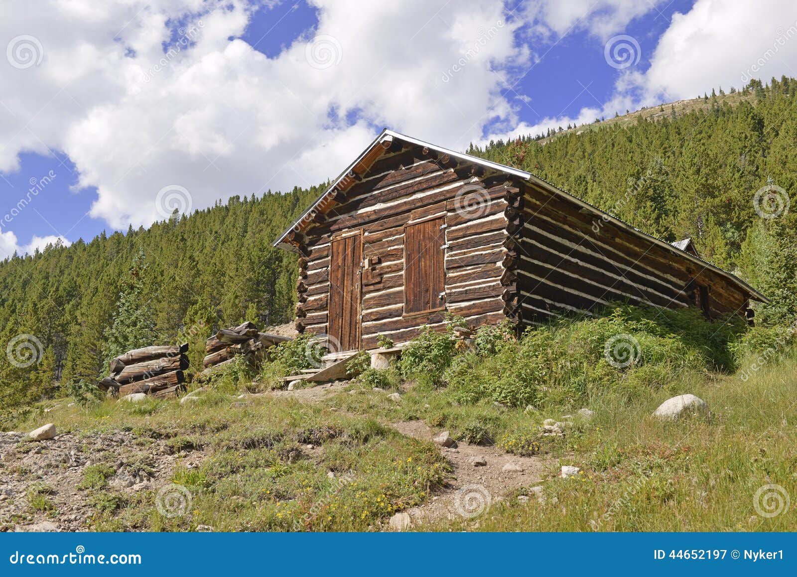 Vintage log cabin on farm in the mountains. Vintage log cabin in old mining town