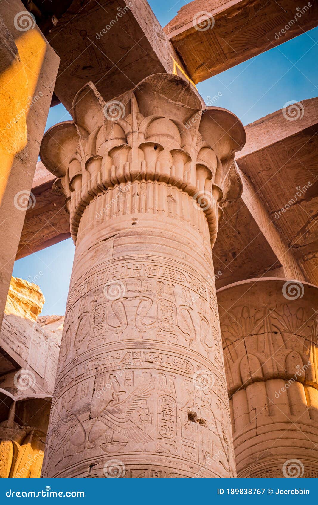 vintage lotus flower decorates the top of the columns at kom ombo temple