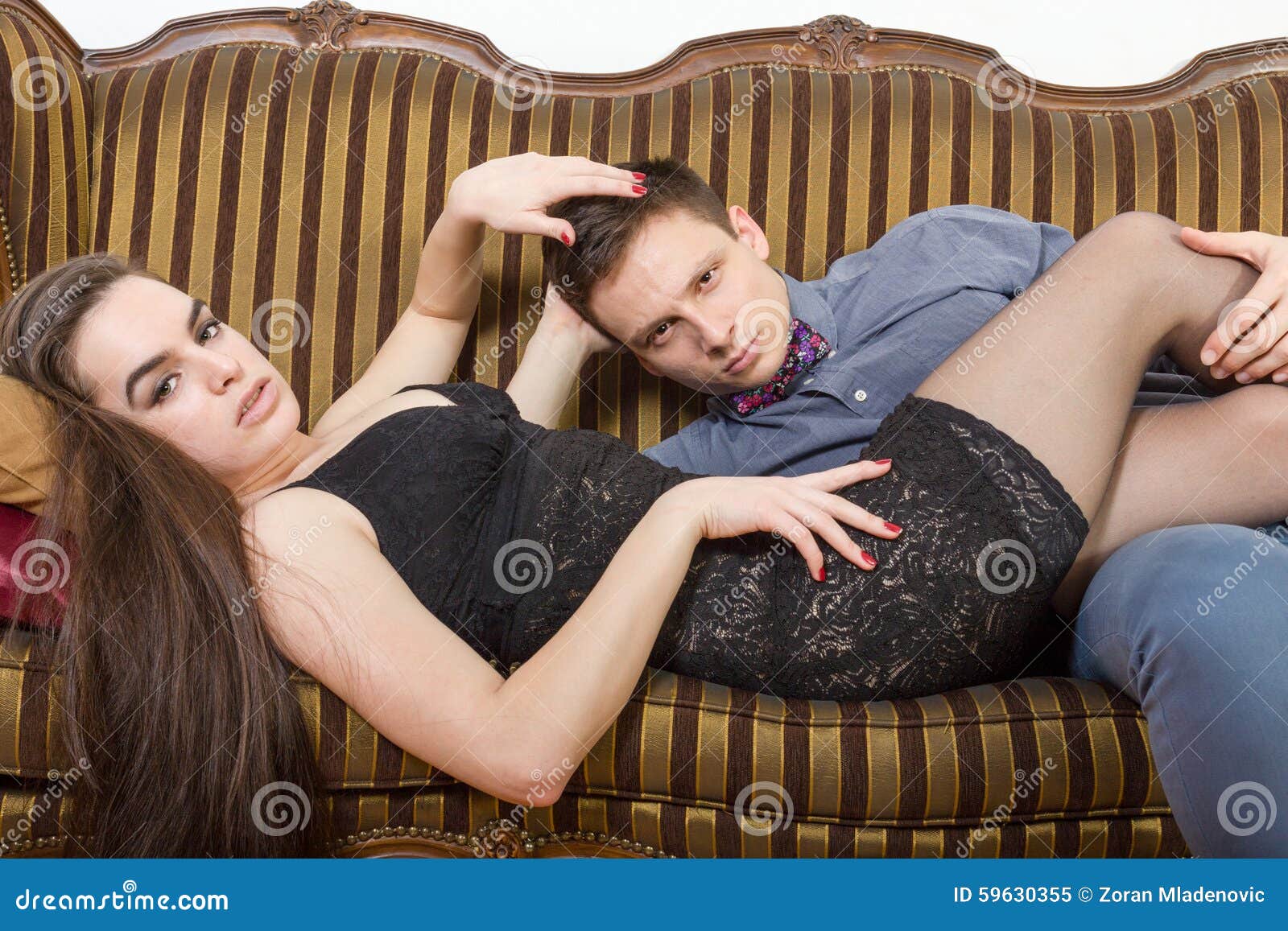 Vintage Male And Female Model On Sofa At Home Stock Image Image