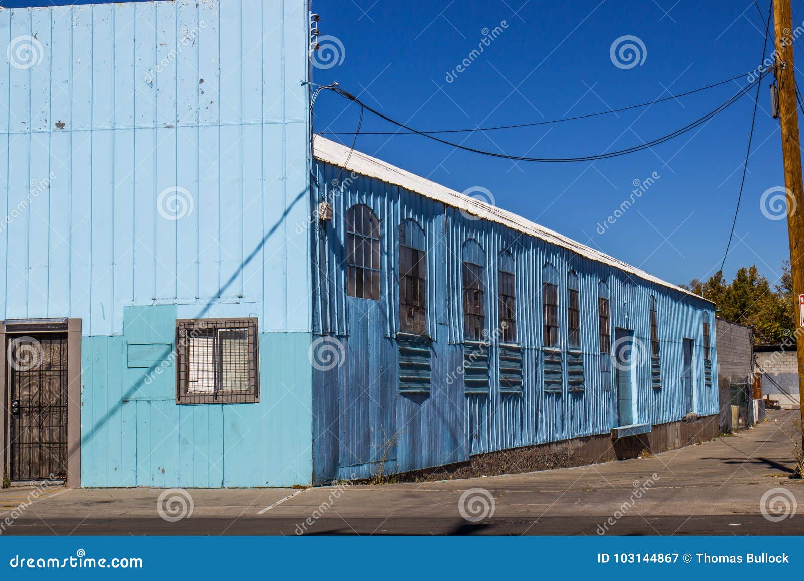 Vintage Metal Building with Broken Windows Stock Image Image of