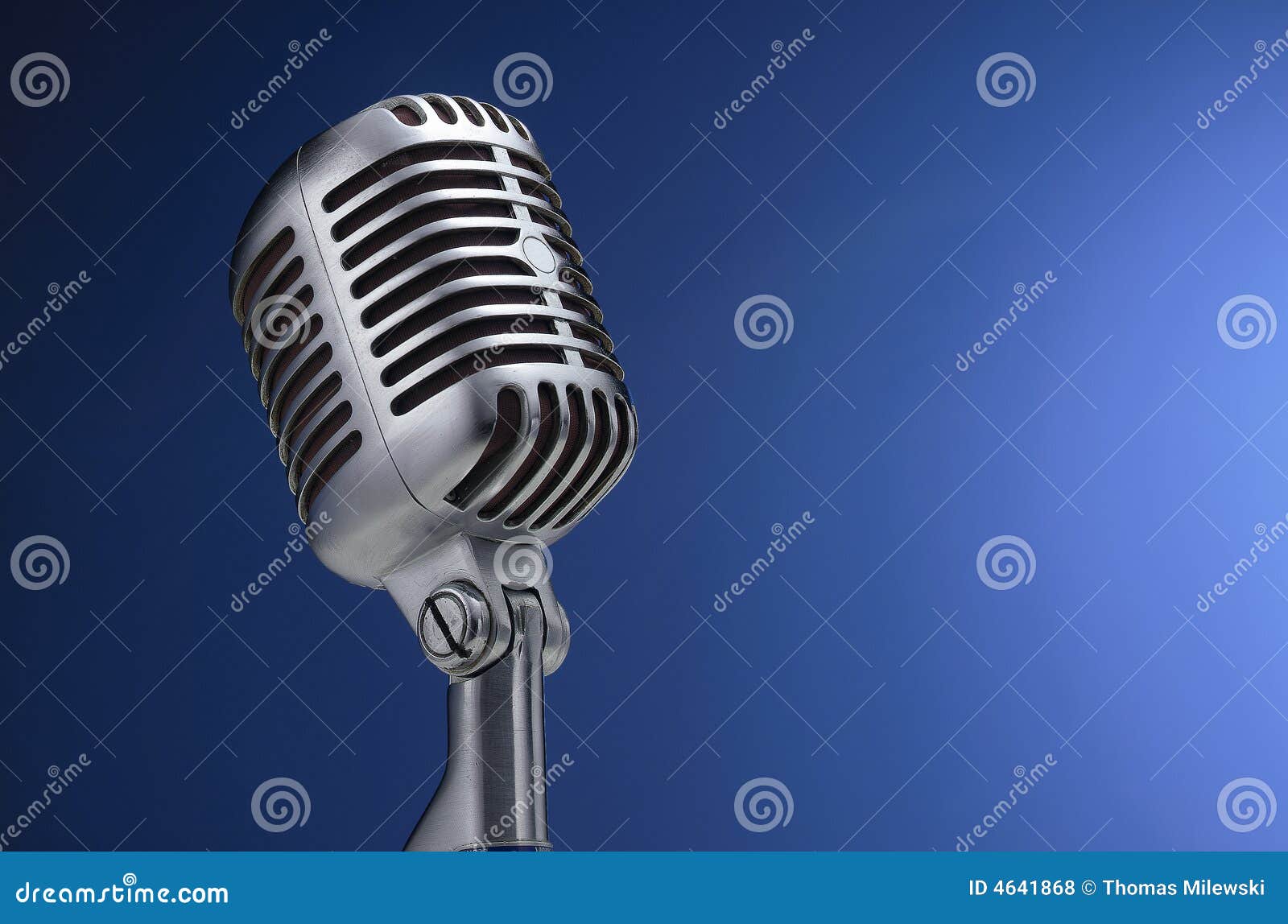 vintage microphone on blue