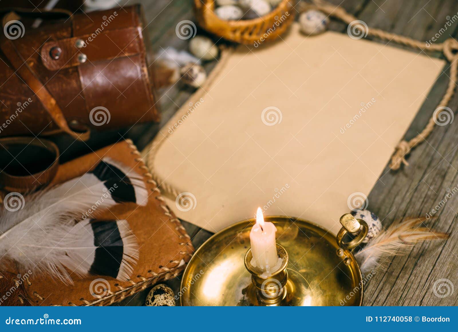 Download Vintage Mock Up Closeup Candlestick With Burning Candle Quail Eggs Yellow Paper For Text On Rustic Wood Board Stock Photo Image Of Background Nest 112740058 PSD Mockup Templates