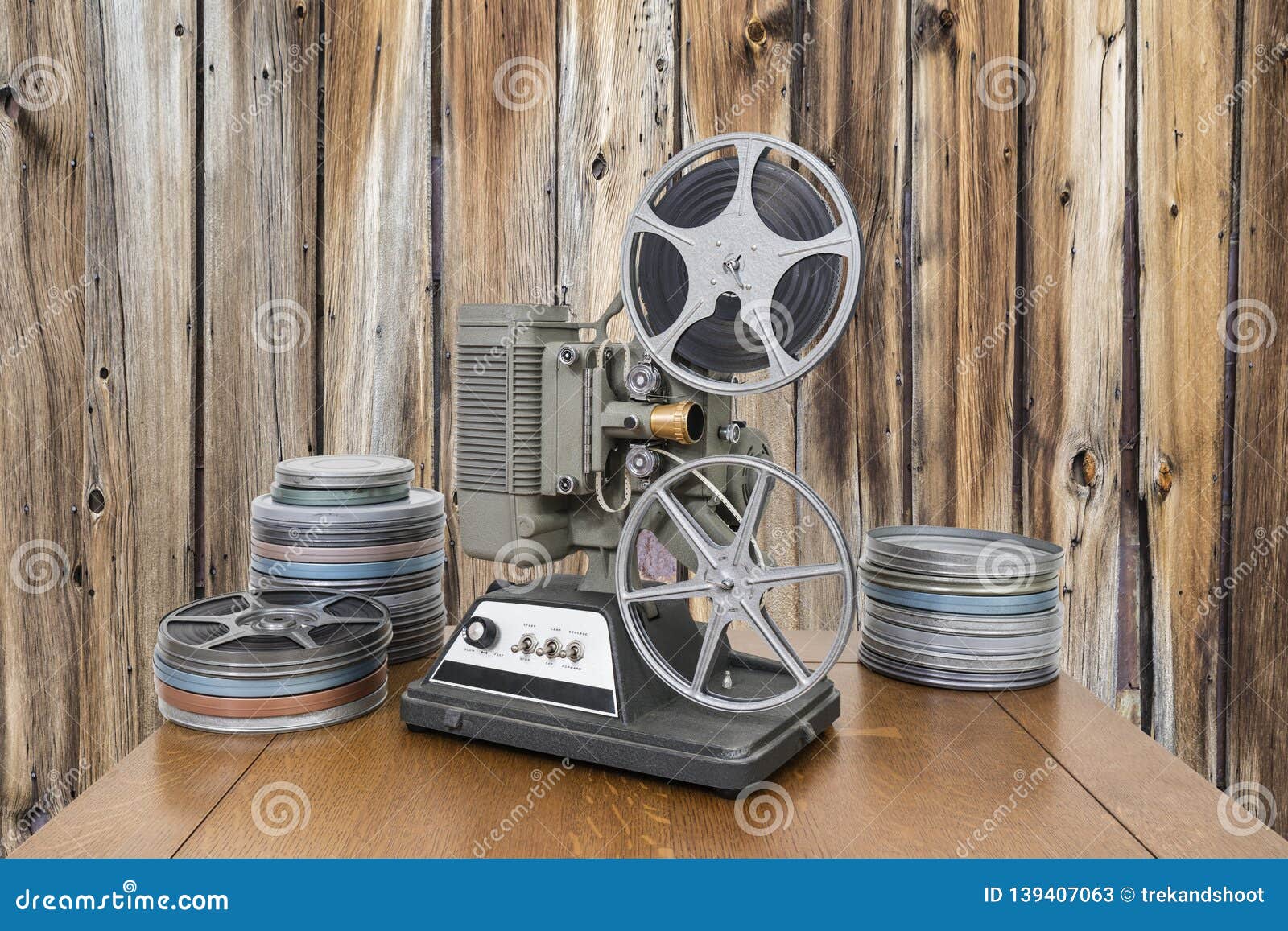 https://thumbs.dreamstime.com/z/vintage-movie-projector-film-cans-old-wood-wall-vintage-mm-home-movie-projector-film-cans-old-wood-wall-139407063.jpg